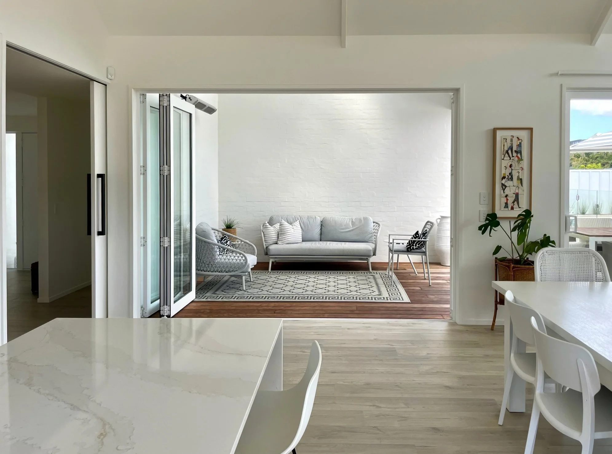 Swordfish exterior open courtyard with outdoor seating area, Elite Building Mangawhai
