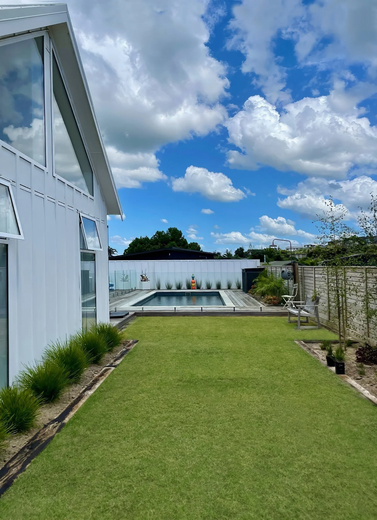 Swordfish new home build with manicured lawn and established gardens, Northland