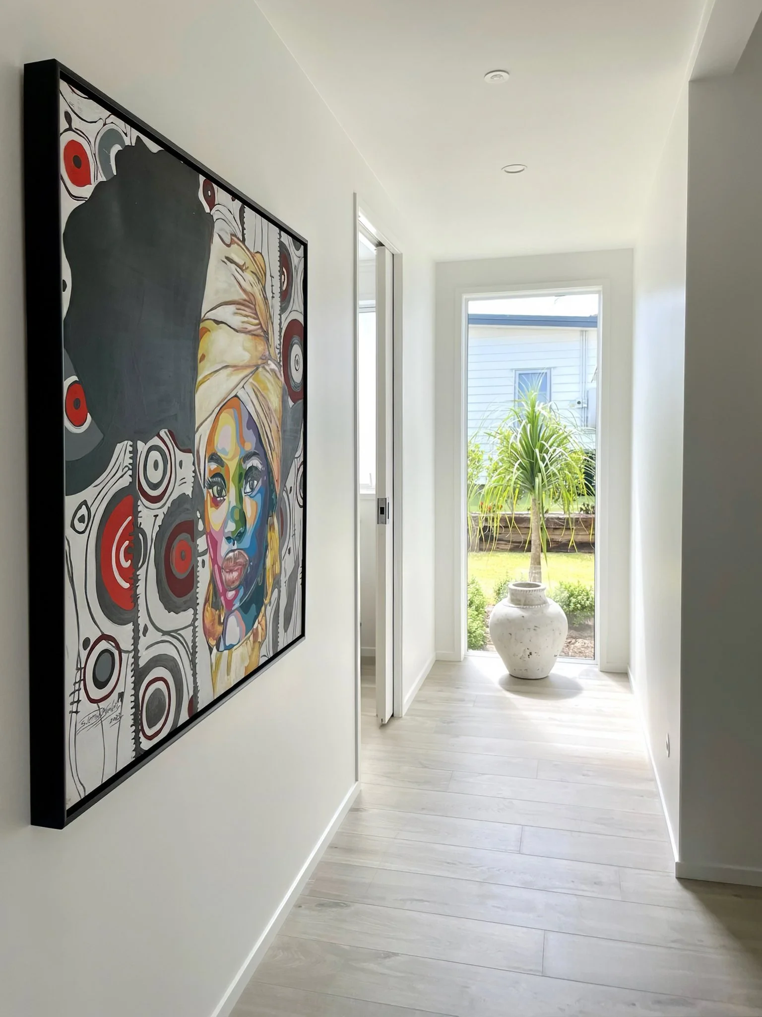 Swordfish luxury new home hallway with artwork and timber flooring, Northland