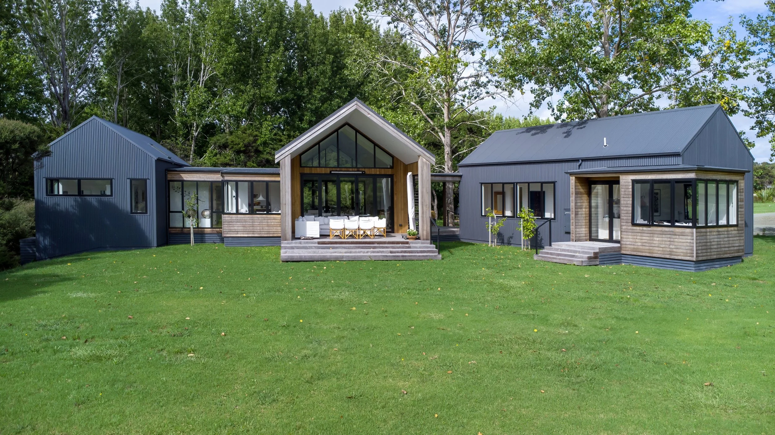 Waiotahi Drive new home build with gabled roof and outdoor entertaining deck, Elite Building Mangawhai