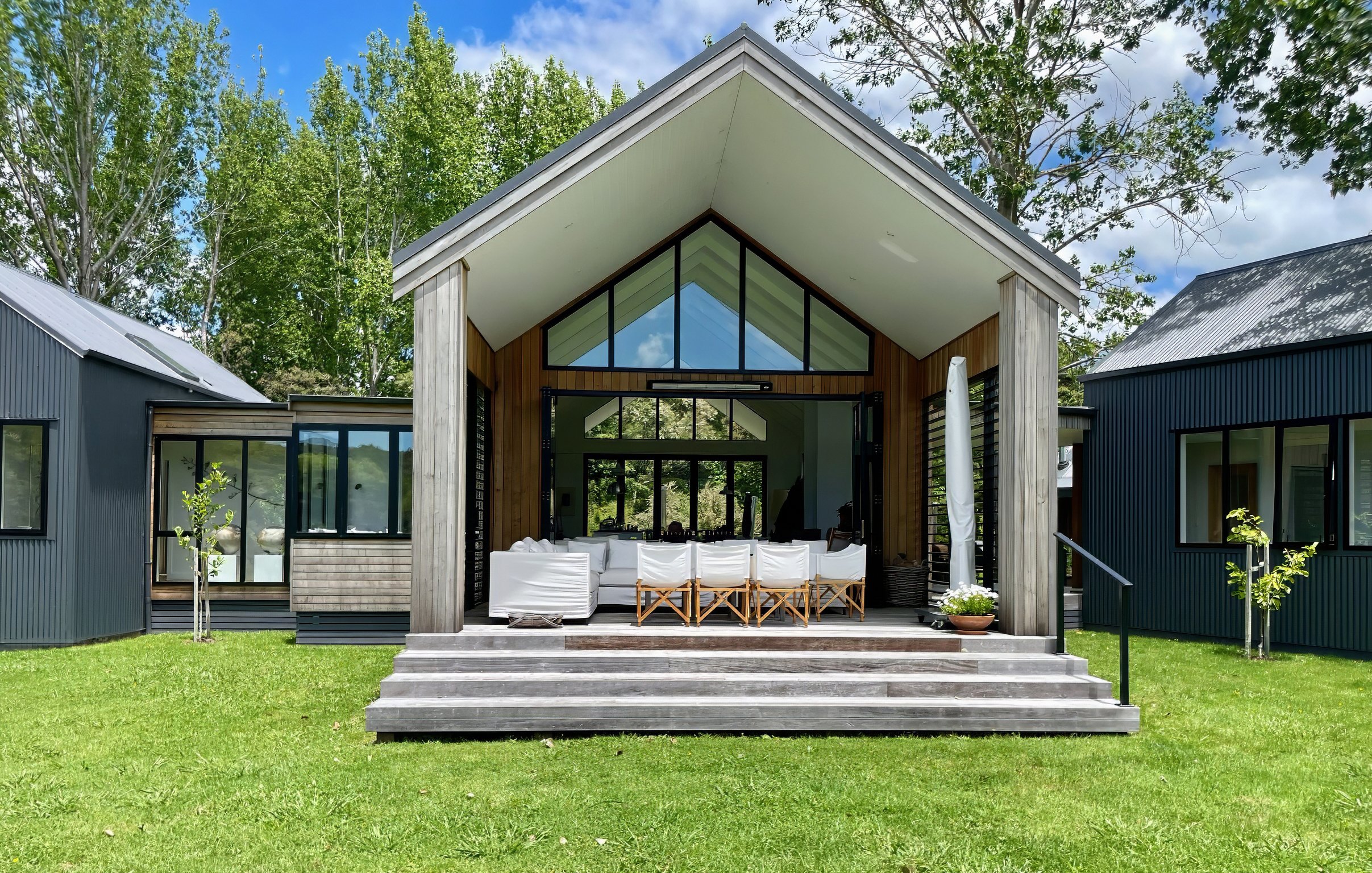Waiotahi Drive new home build front elevation with floor to ceiling windows, Elite Building Northland