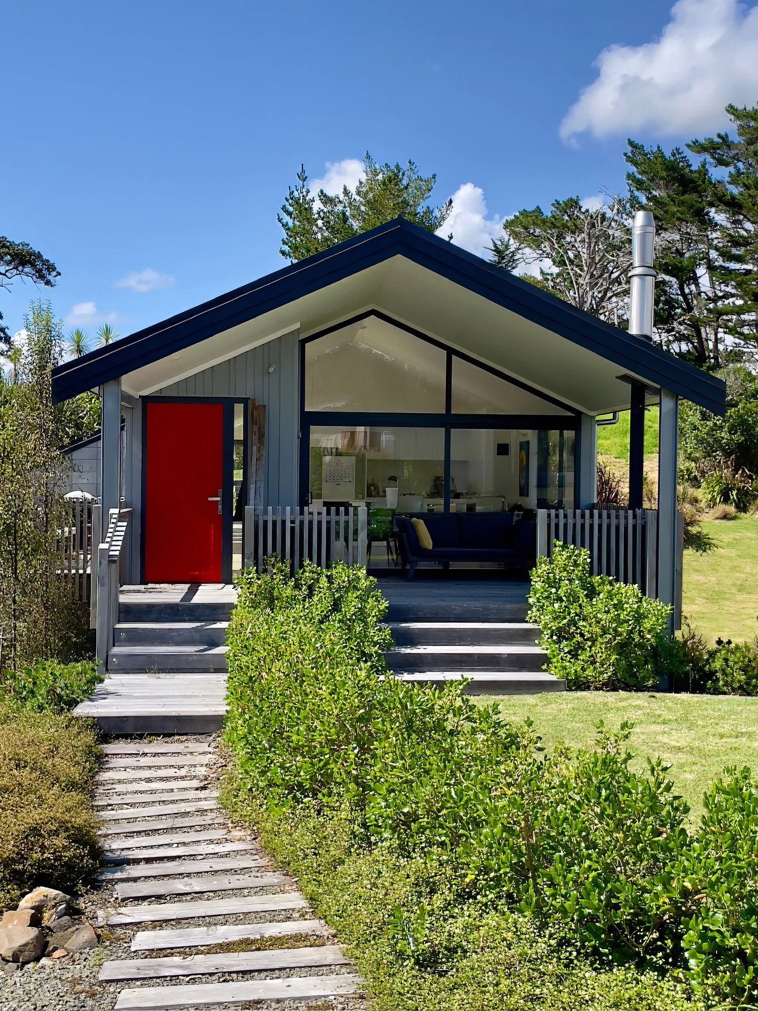 Mangawhai Point new home exterior with red front door, Mangawhai