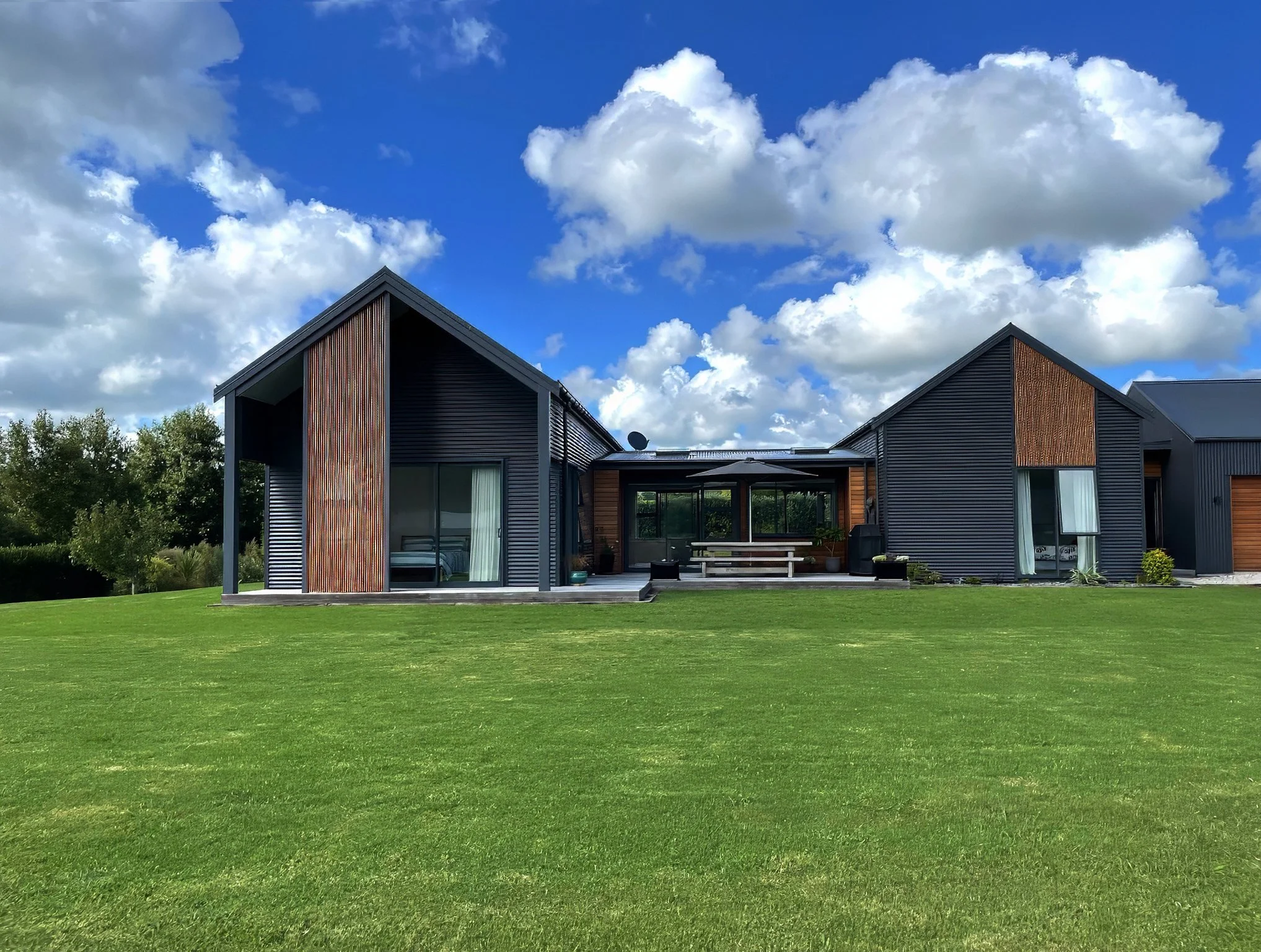 Alexandra Lane luxury new home aerial view with cedar and colour steel cladding, Elite Building Northland