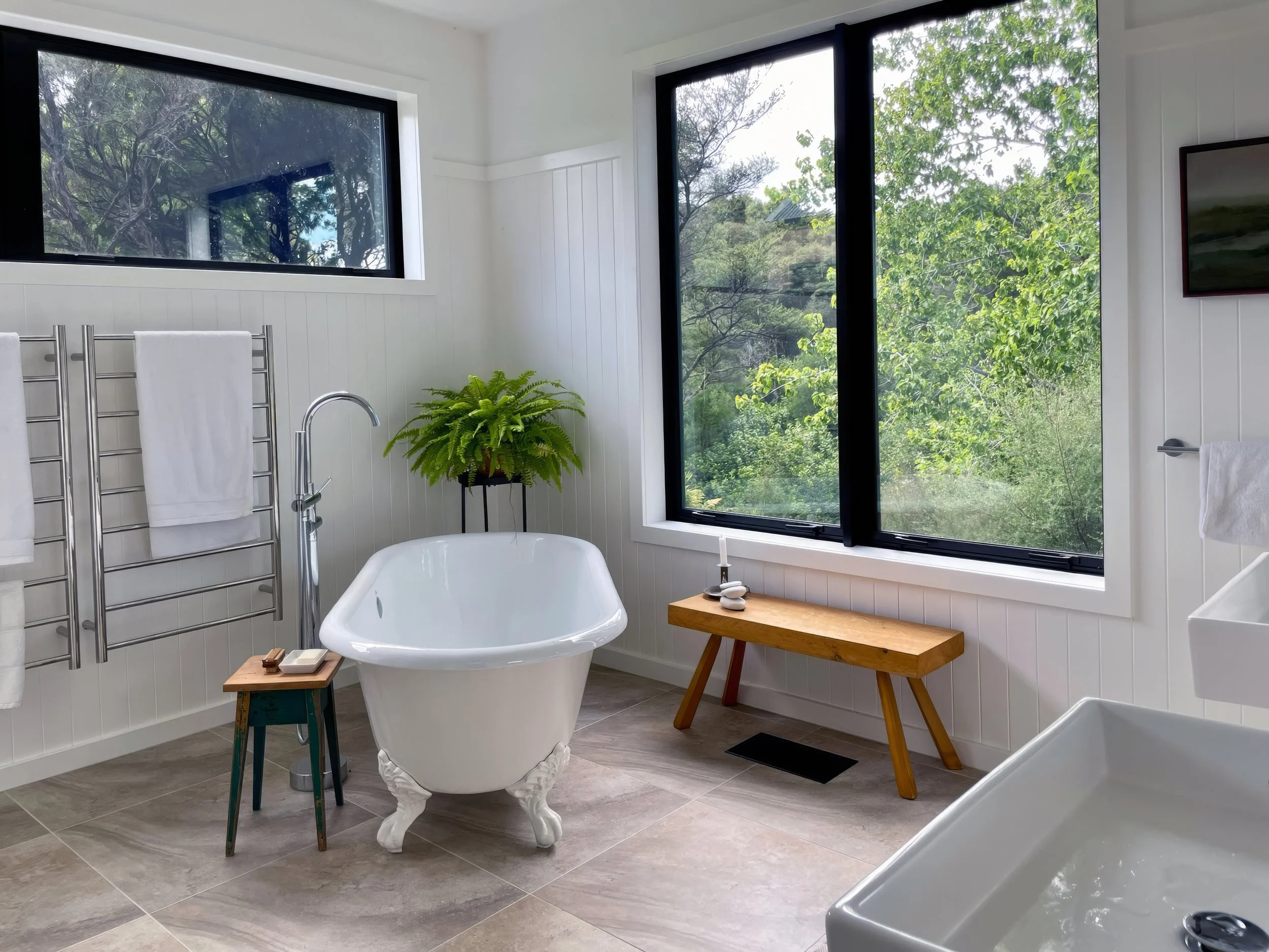 Luxury bathroom with freestanding bathtub and garden views, Elite Building Northland