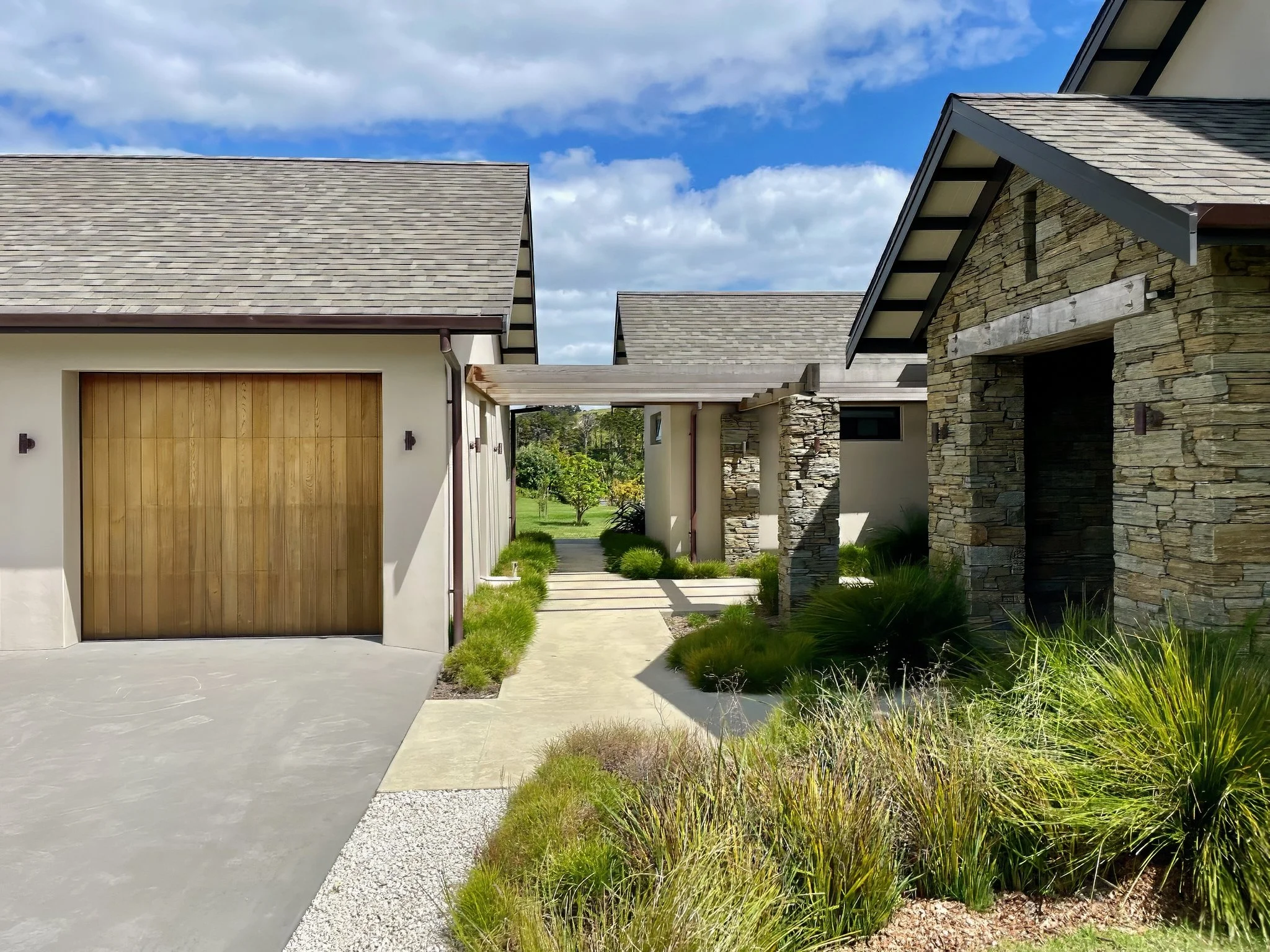 New home build with timber cladding and landscaped gardens, certified builders Mangawhai entrance made with Porotherm blocks imported from Europe