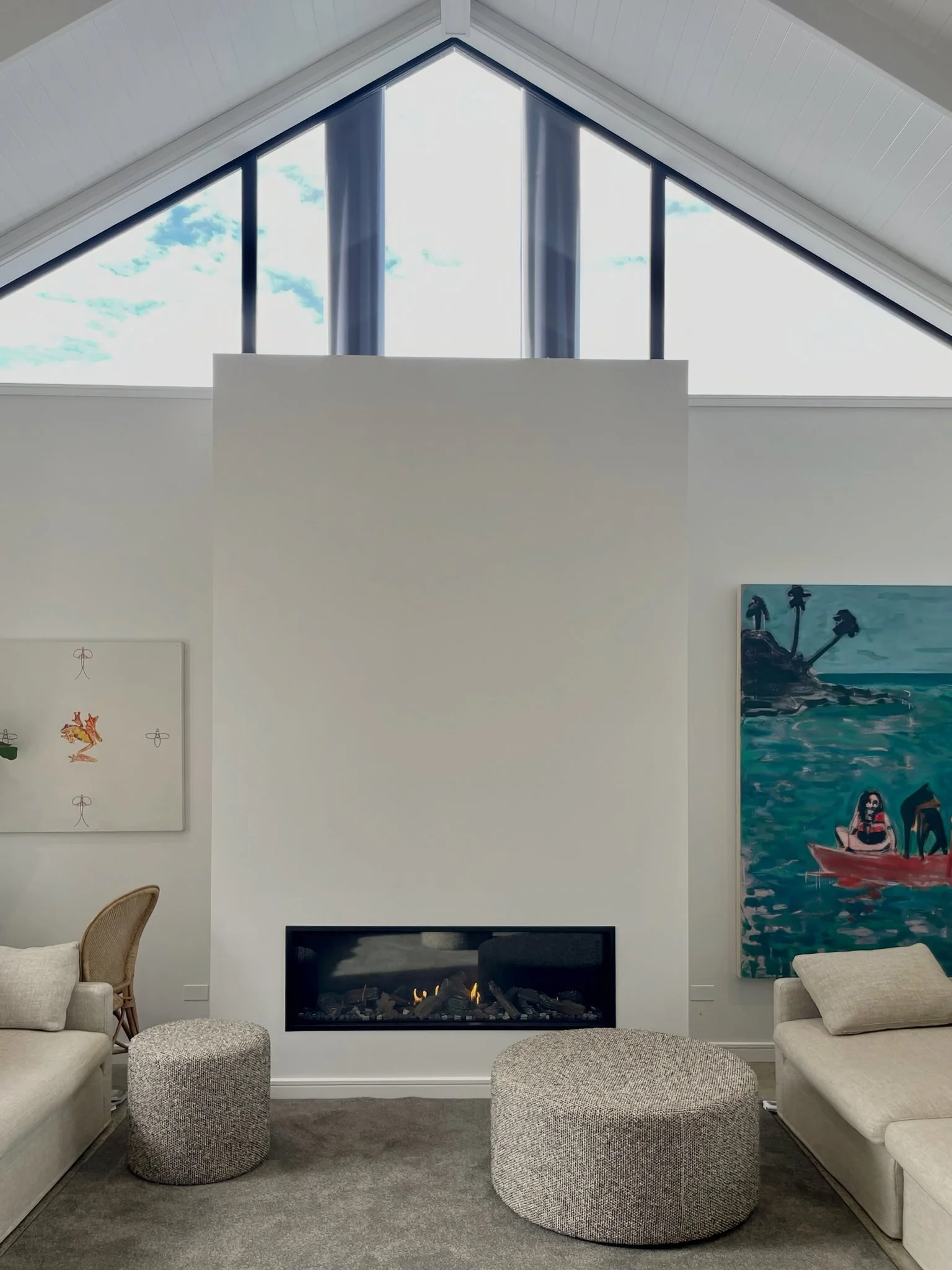 Sand Dune luxury living room with fireplace and coastal artwork, Northland