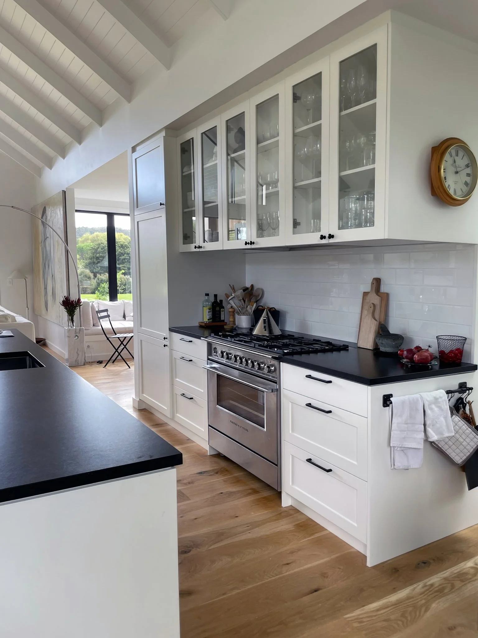 White kitchen with Aga oven and glass cabinetry, Waiotahi Drive Elite Building Mangawhai