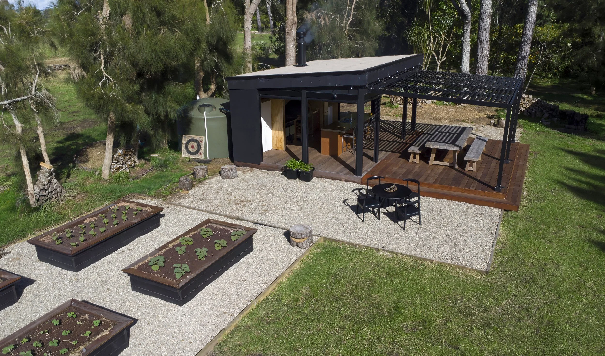 Elite Building new house build in Mangawhai exterior drone shot kitchen and planter beds