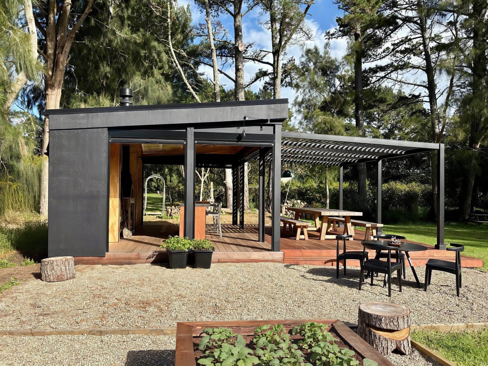 Board and batten outdoor kitchen pavilion on kwila deck, Black Swamp Road Mangawhai