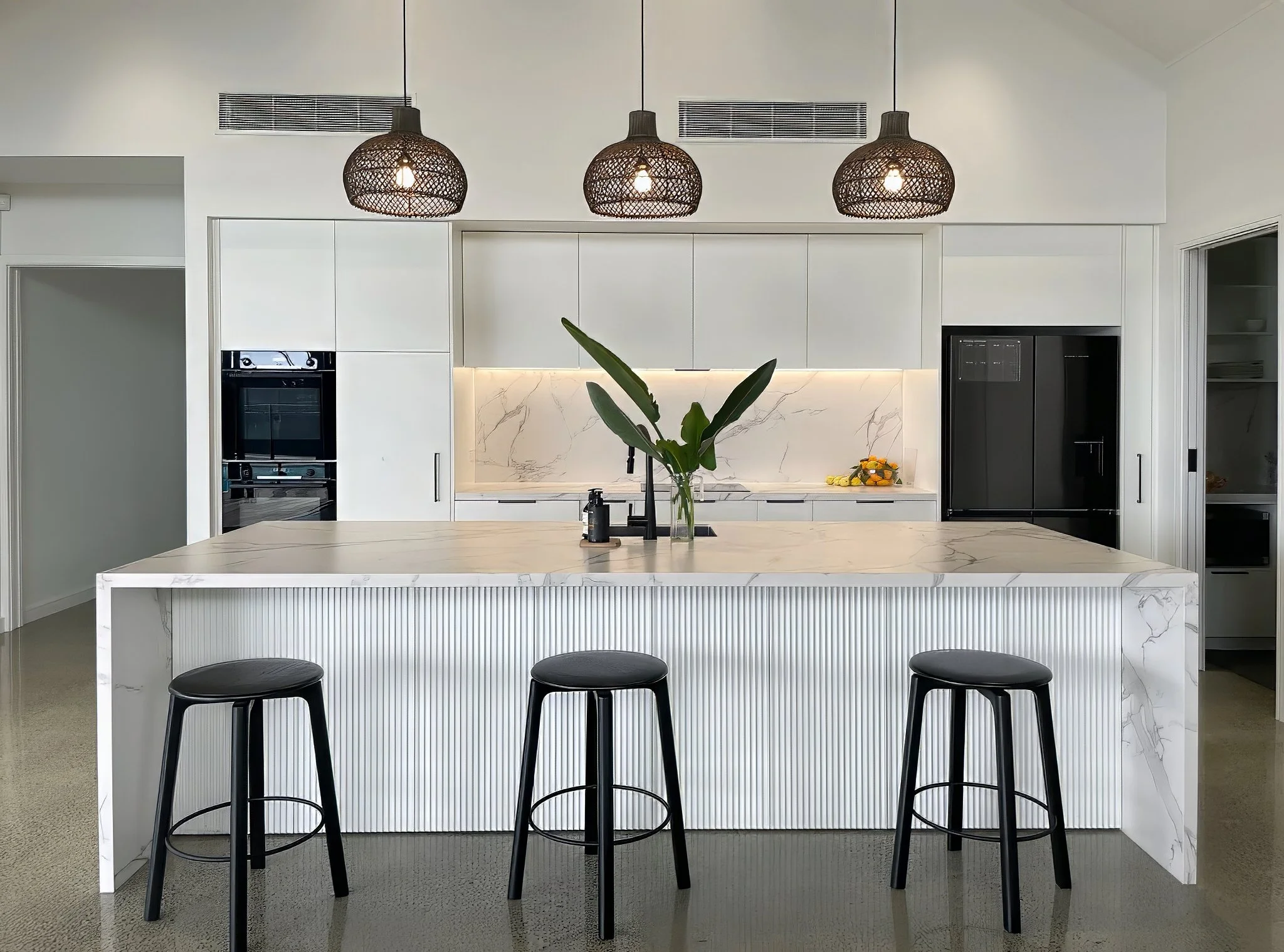 Sand Dune luxury kitchen with marble benchtop and black pendant lighting, Elite Building Mangawhai