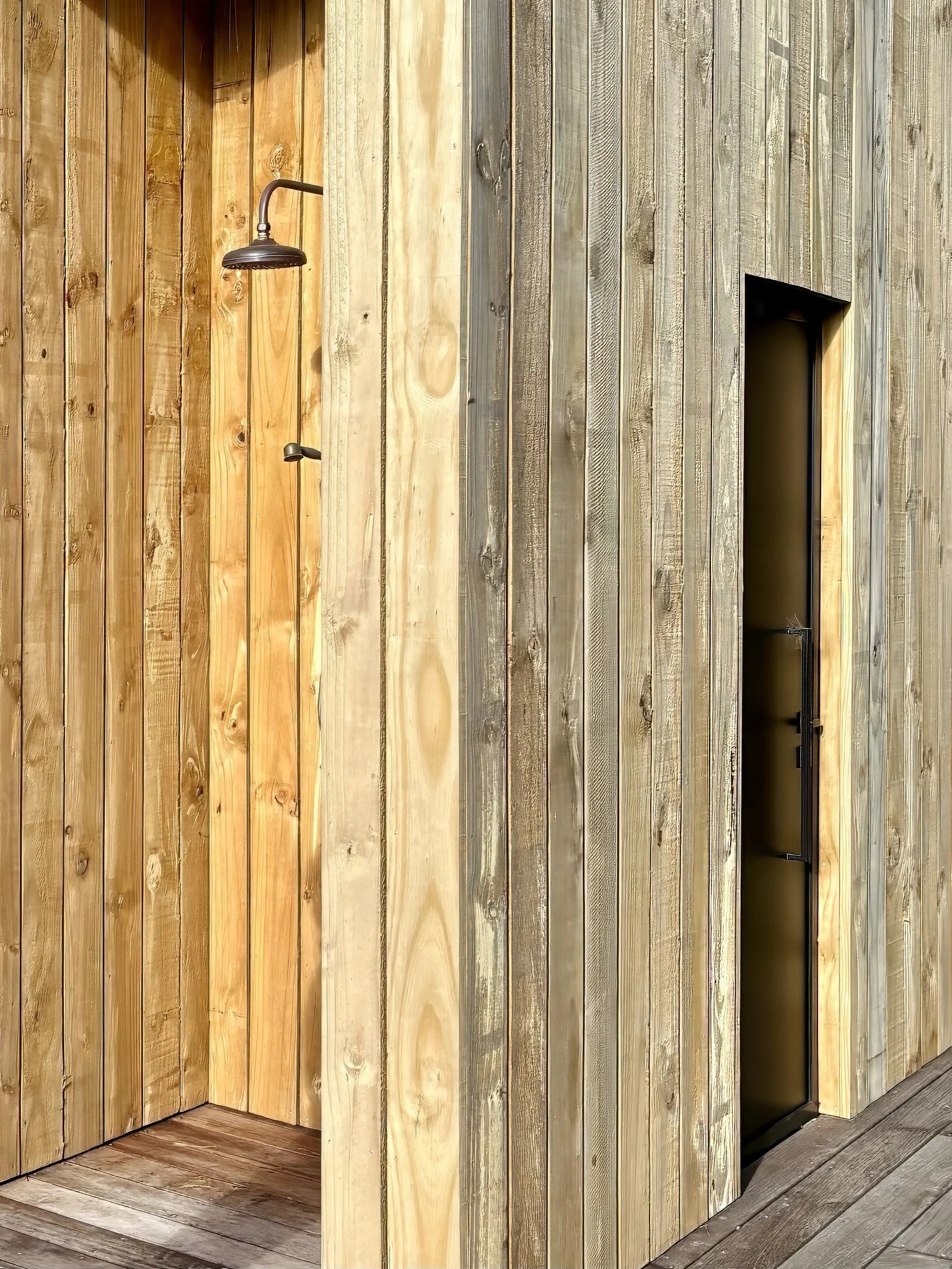 Outdoor shower with timber facade, Black Swamp glamping lodge Northland