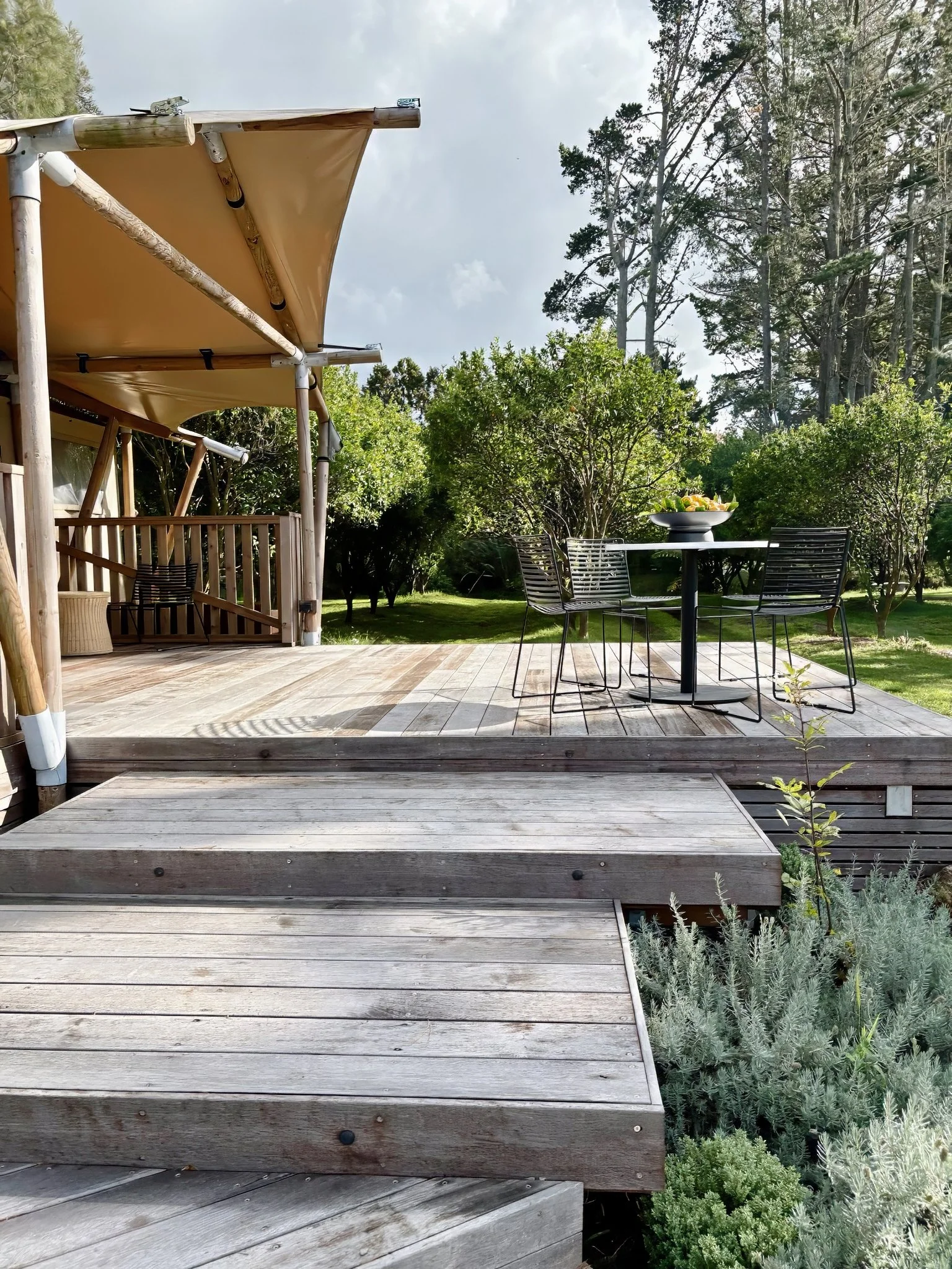 Bespoke glamping retreat exterior with floating timber stairs, Mangawhai