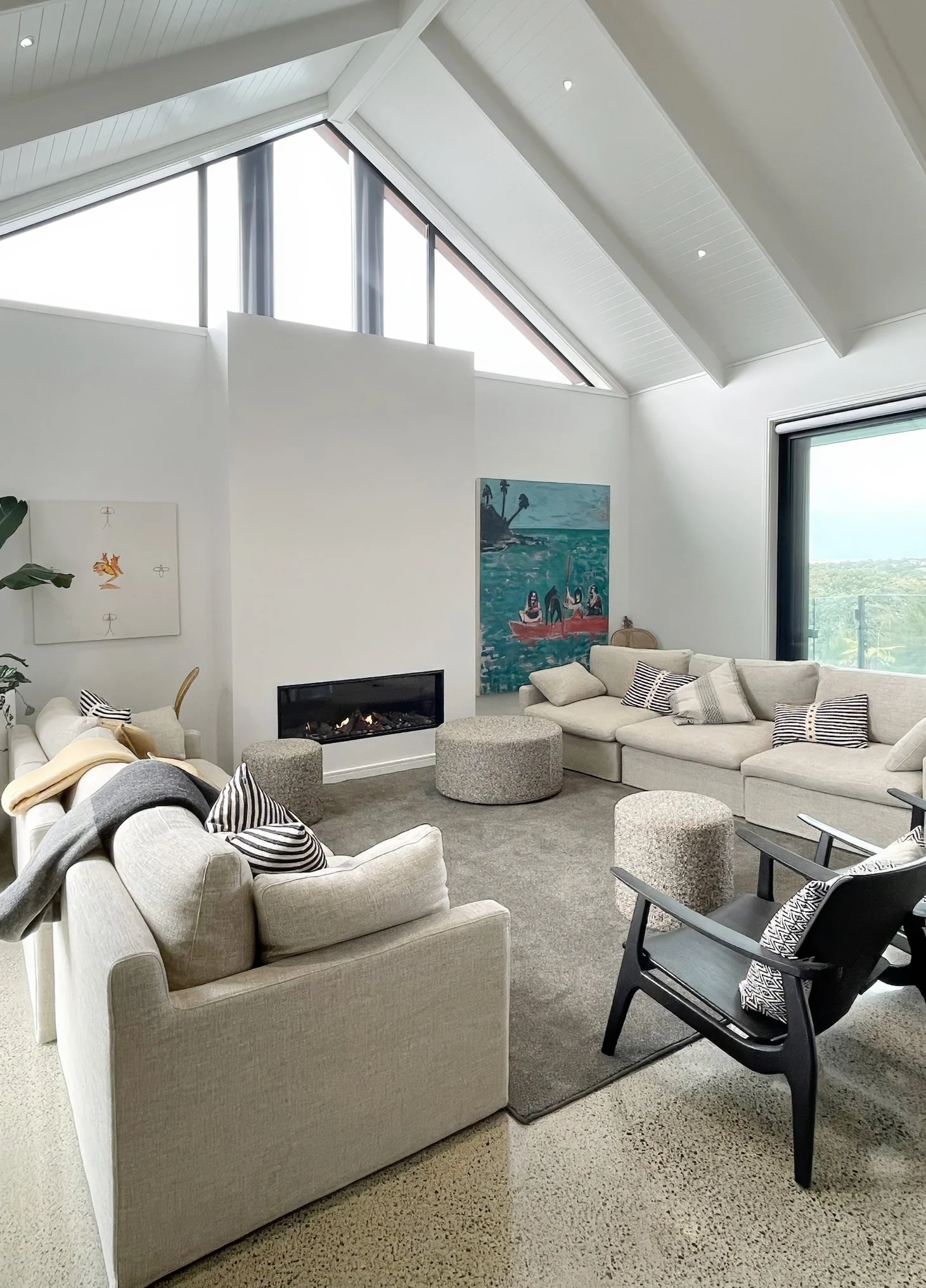 Sand Dune luxury open plan living with vaulted ceiling and coastal artwork, Northland