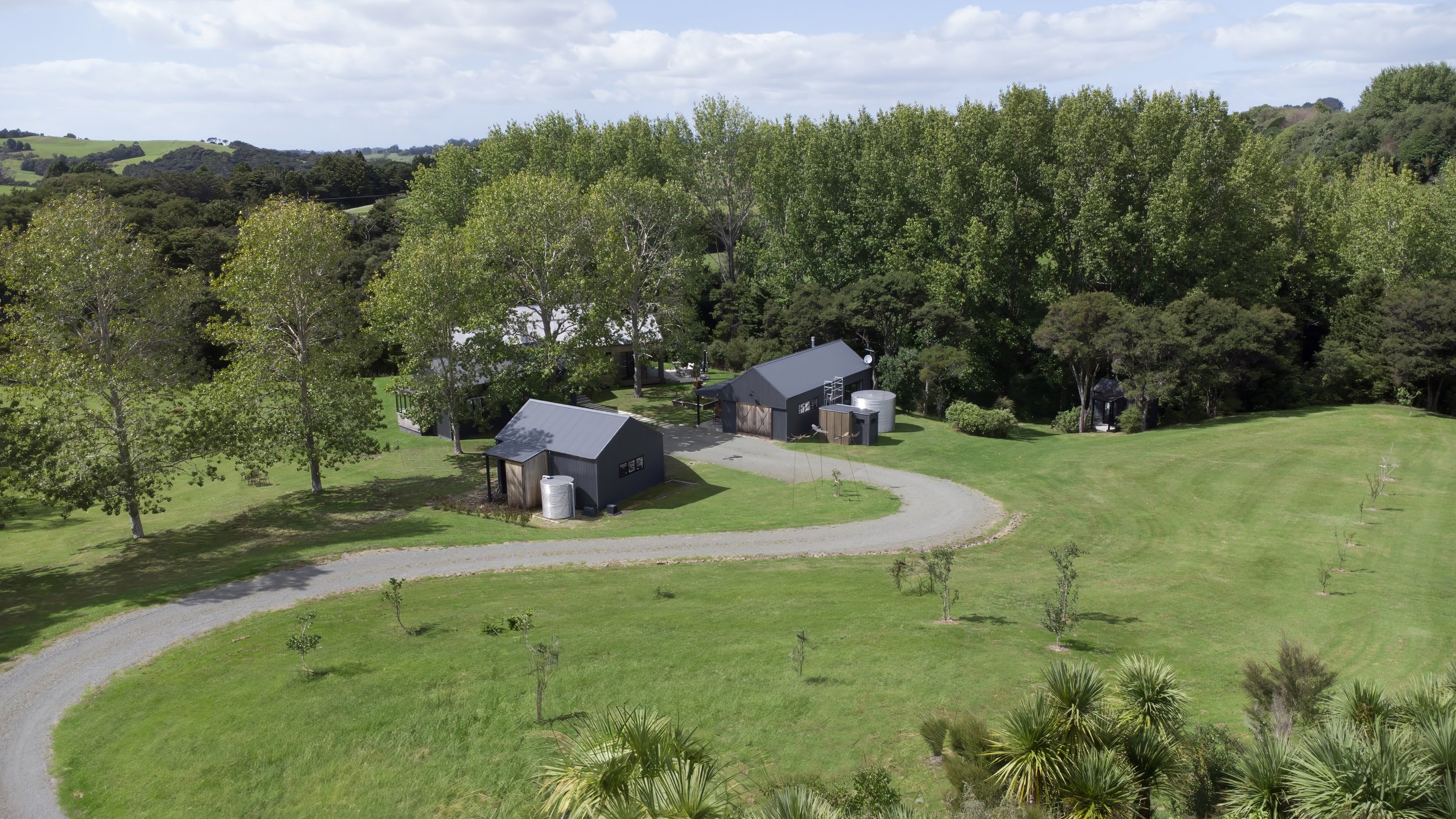 luxury home arial drone shot driveway and garages