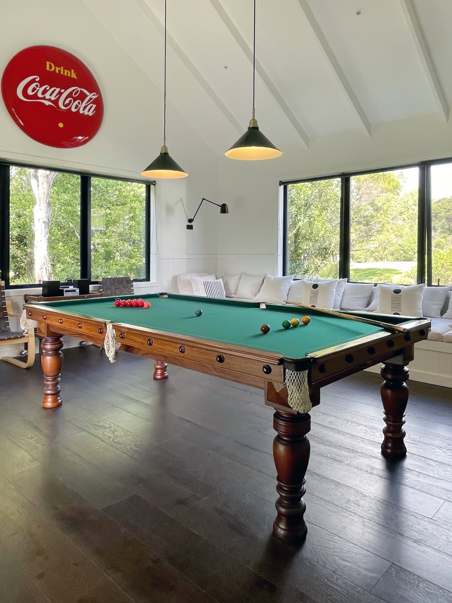 luxury home billiard room with coke sign