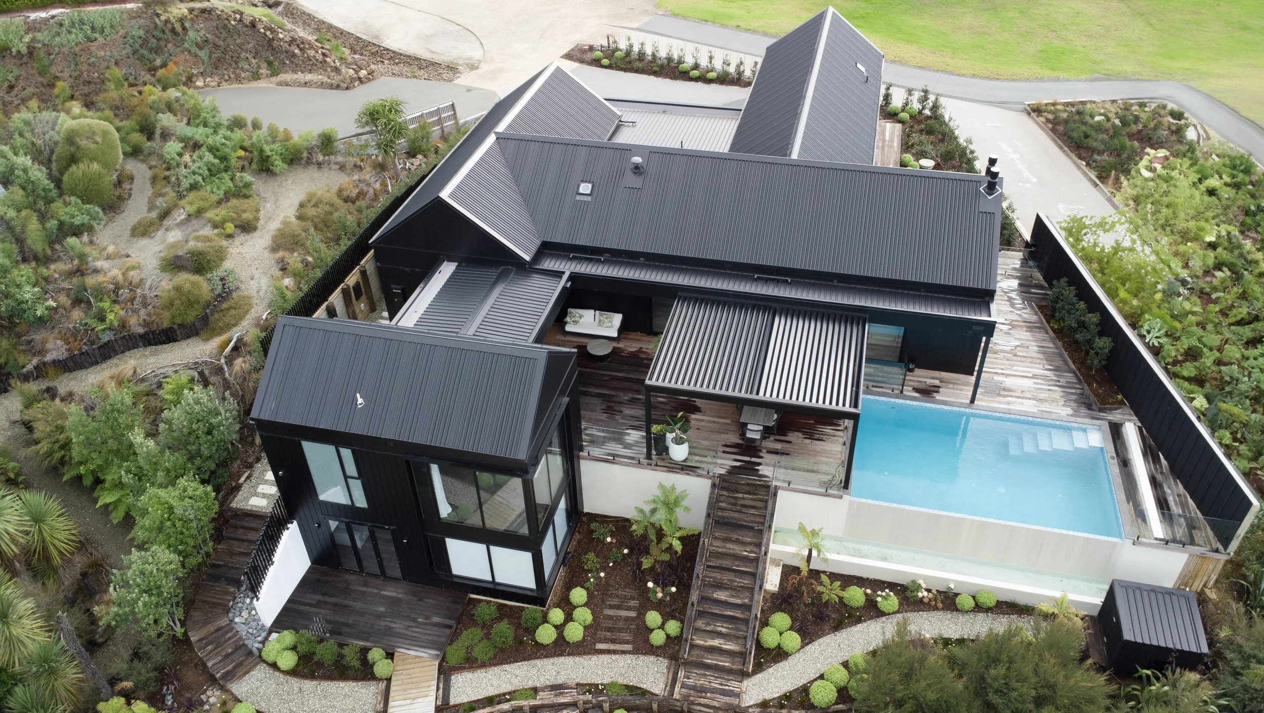 Sand Dune luxury new home aerial view with swimming pool, Mangawhai Northland