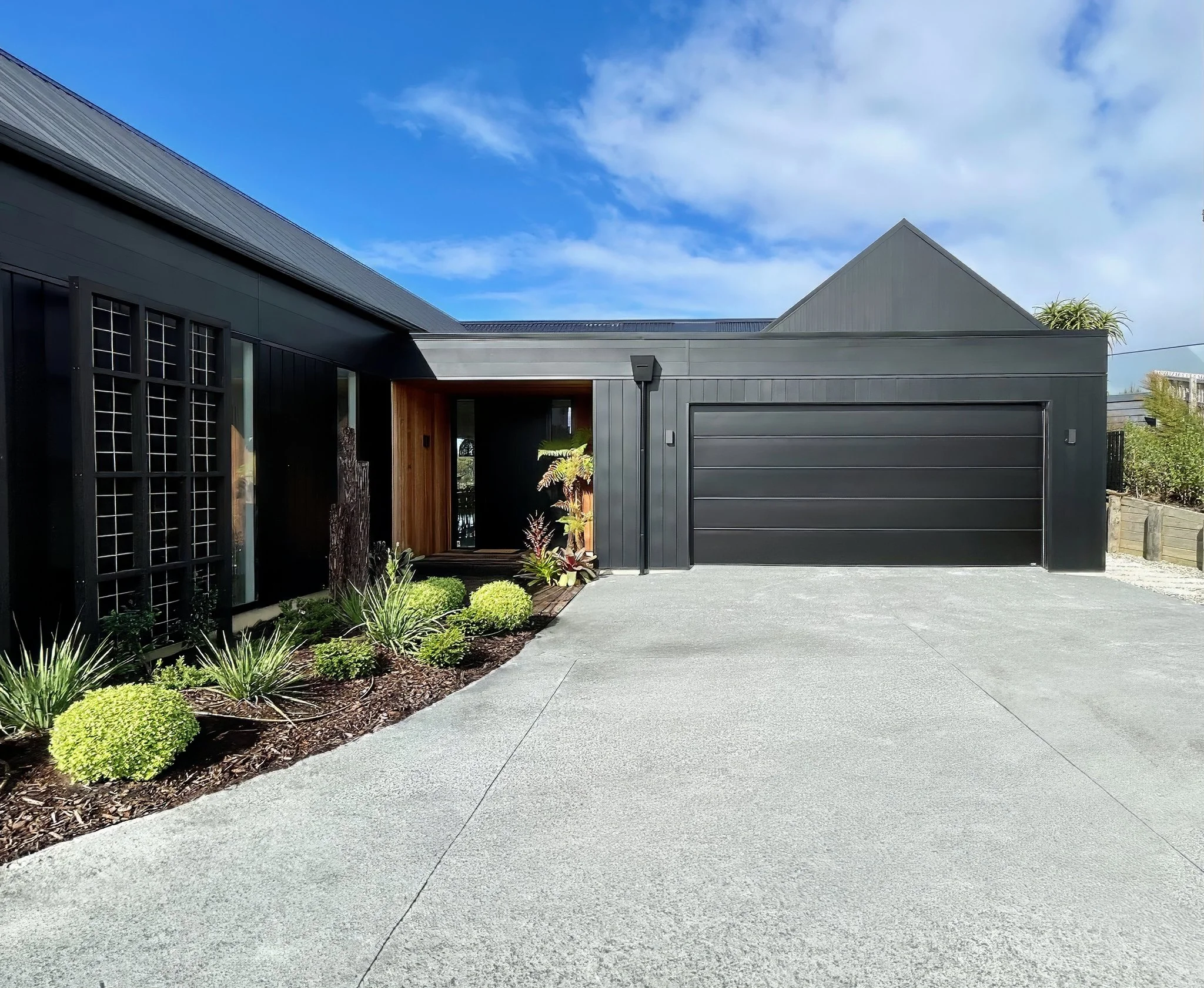 Sand Dune luxury new home driveway with double garage, Elite Building Mangawhai