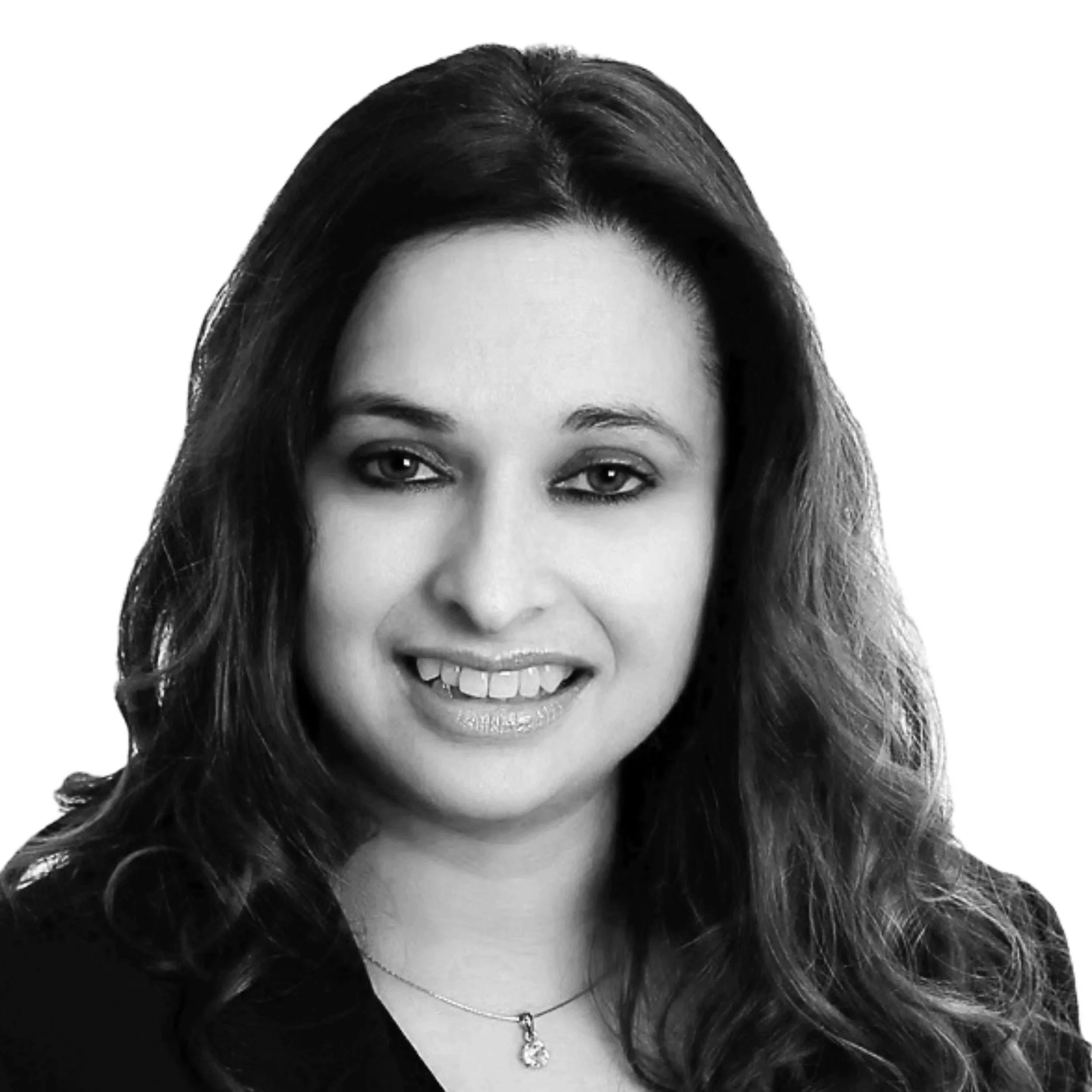 A photo of Payal Walker with shoulder-length brown hair, smiling, against a white background.