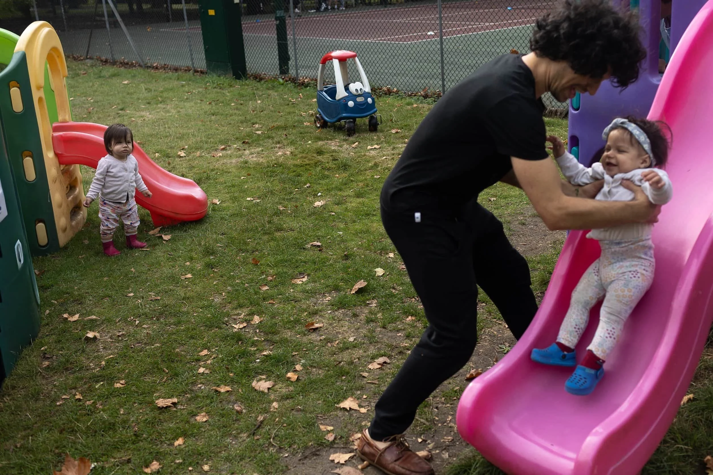 Twin toddlers in the playground at Highbury fields