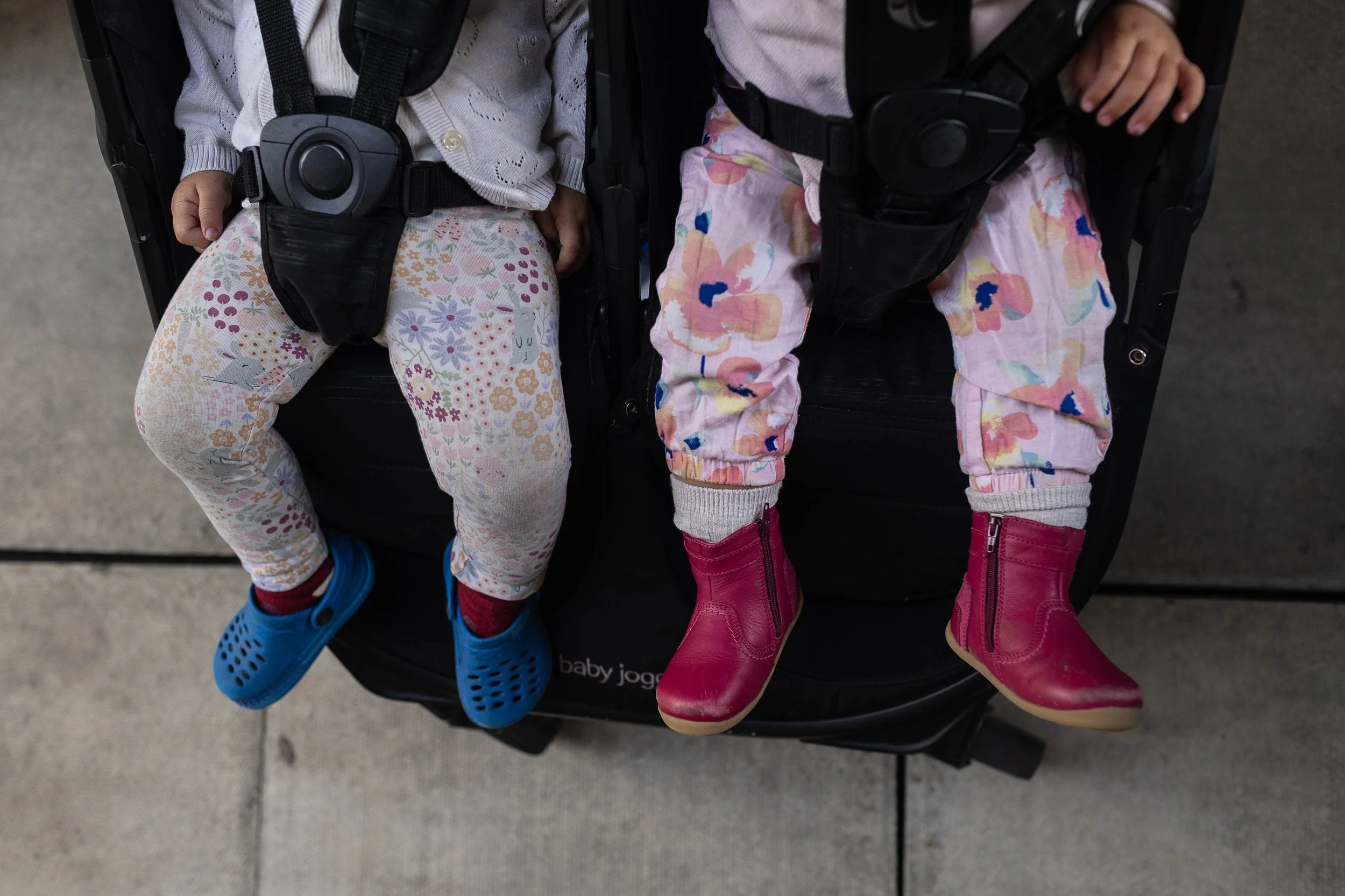 Twins in their buggy during a family photography session in Highbury