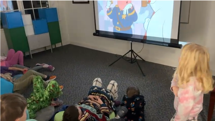 Kids watching a movie at Parent Night Out