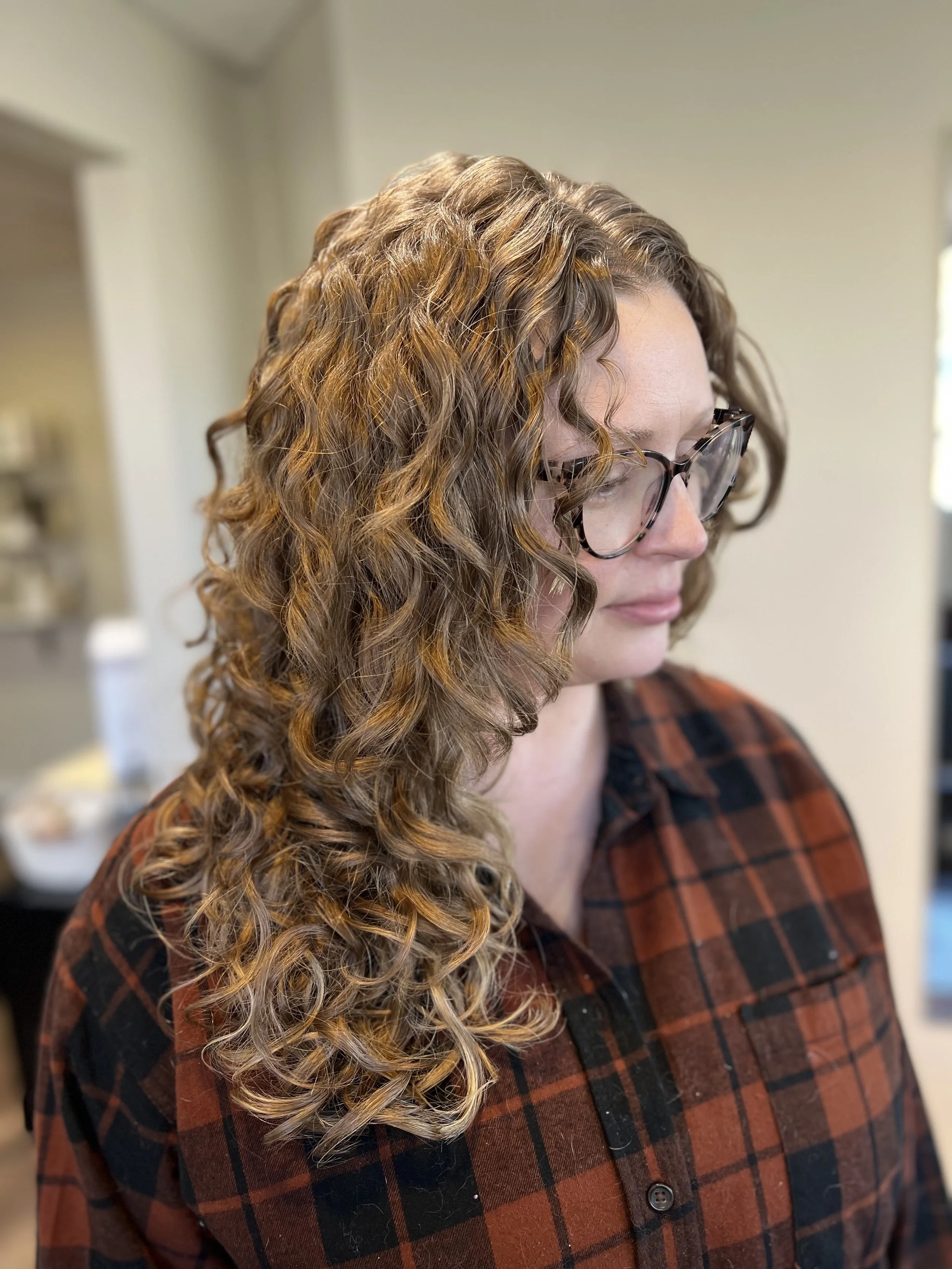 Thick, curly hair after a detox and deep condition hair treatments.