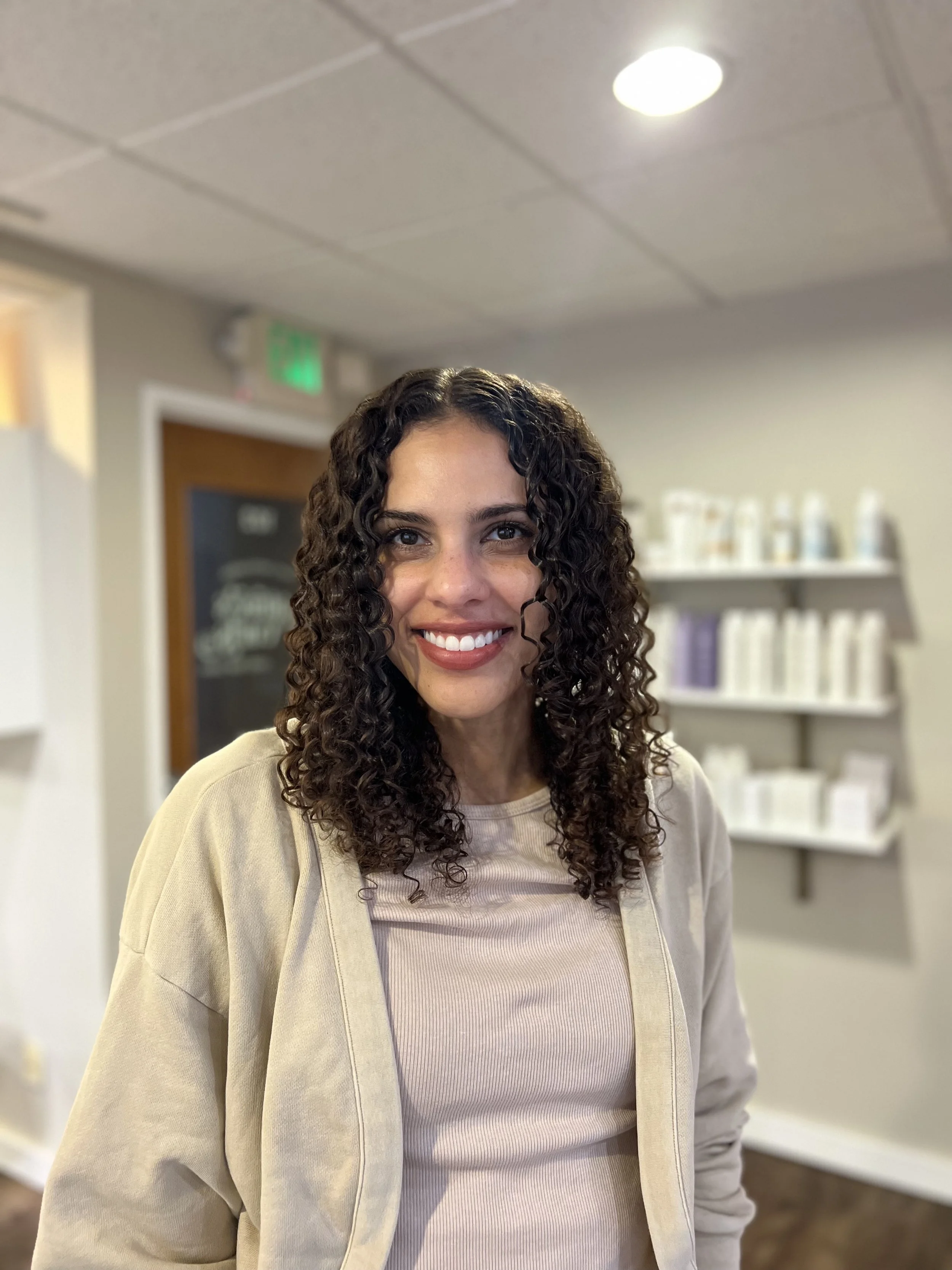 3B curls styled with a brush styling technique.