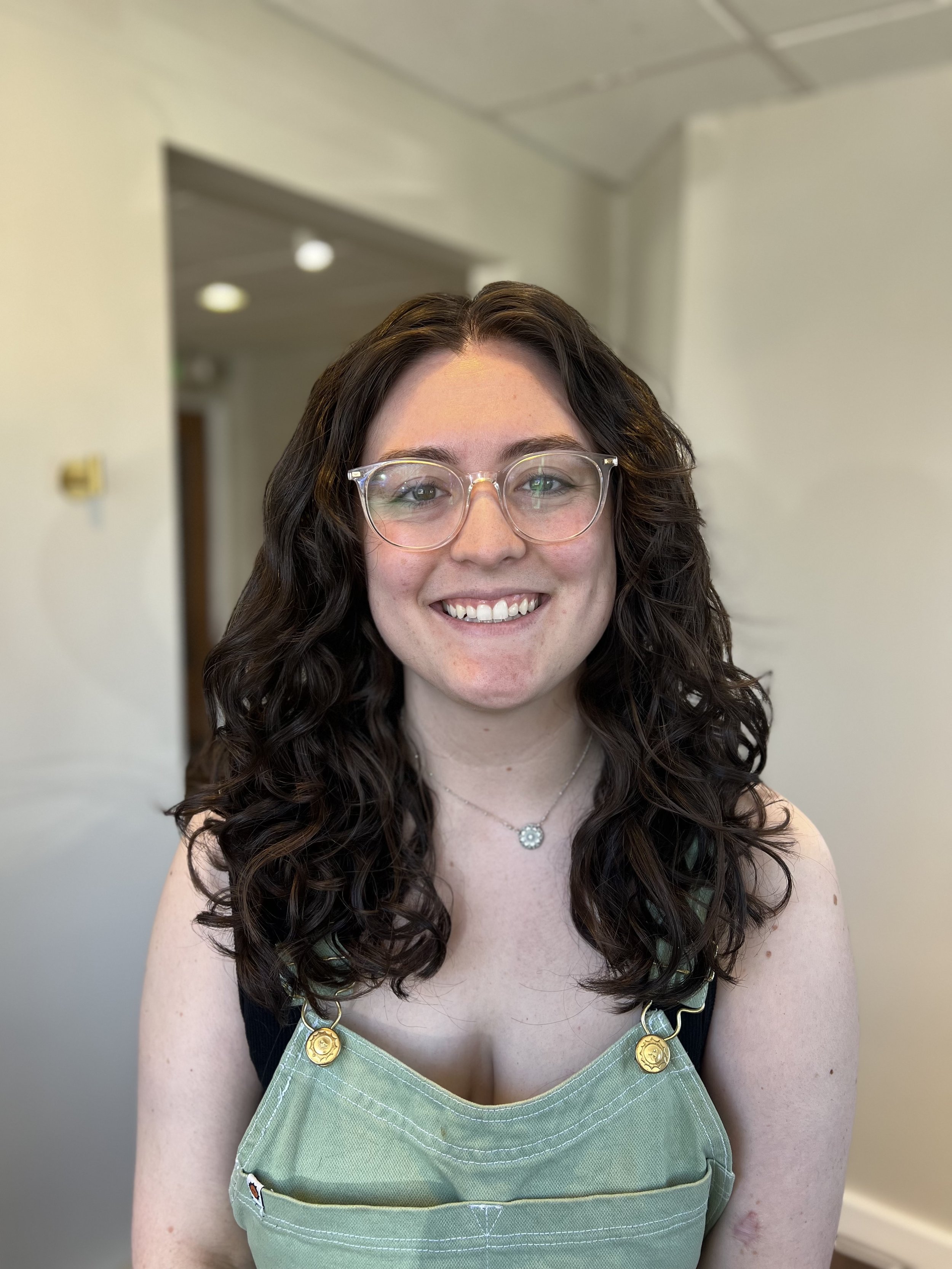 Client after a New Guest Curly Haircut service and hair treatments.