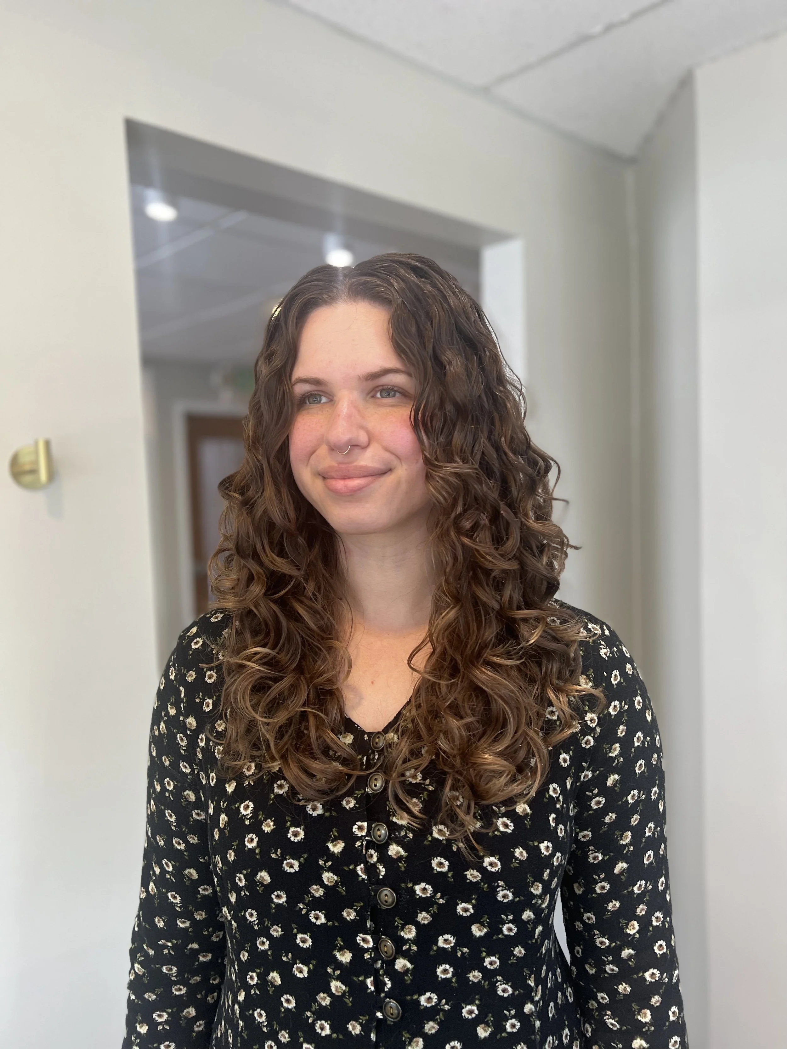 Perfectly defined curly hair after a nourishing hair treatment.