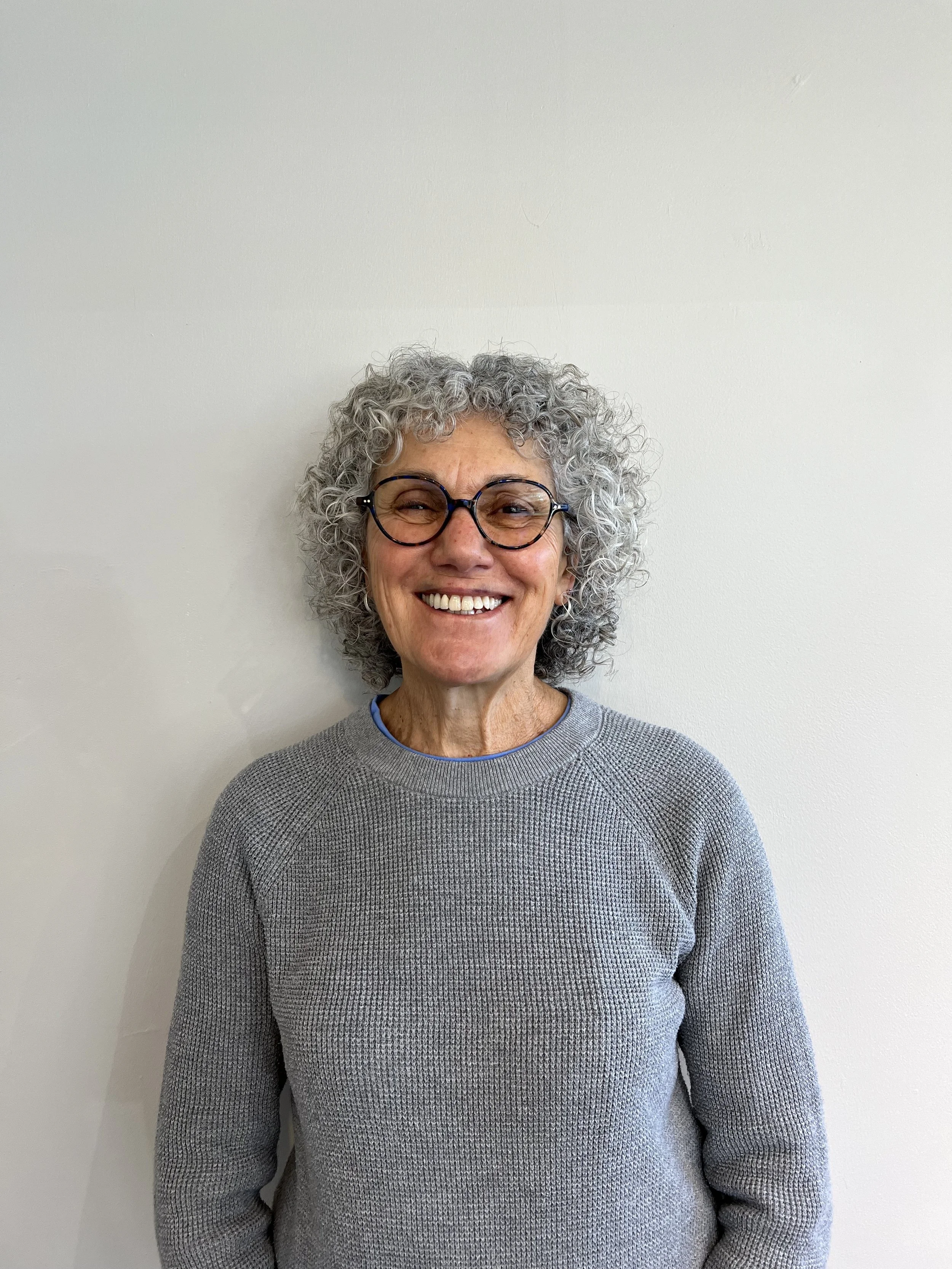 Older woman with very curly 3B hair type.