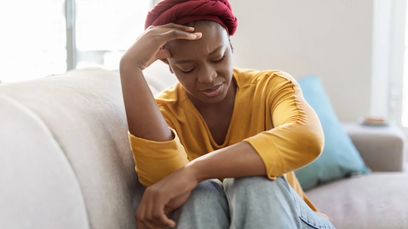 Black pregnant woman navigating pregnancy stress with culturally affirming therapy support