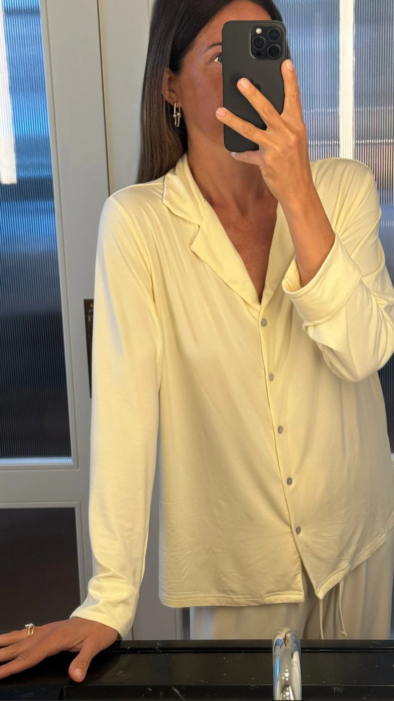 OOTD mirror selfie wearing chic UK minimalistic luxury loungewear womens buttery soft bamboo pyjamas in trending butter yellow colour. 