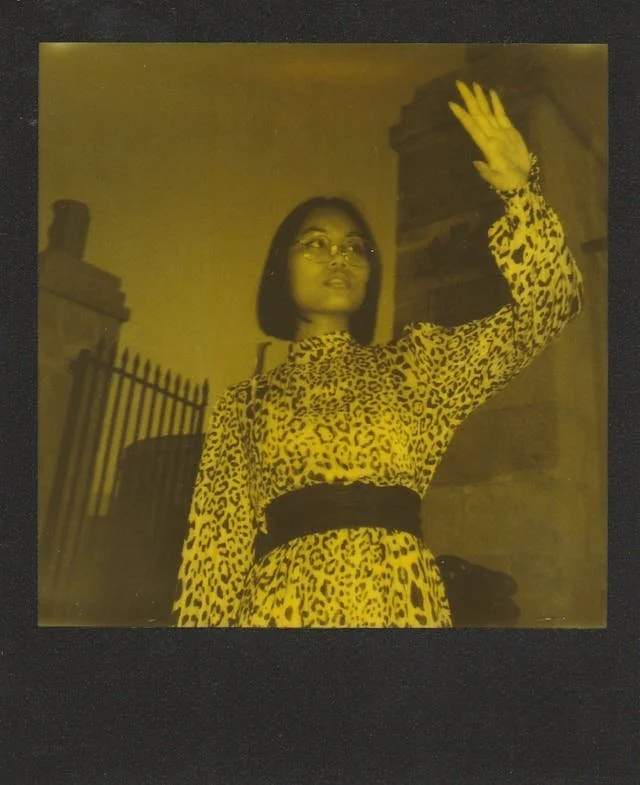 Polaroid of a woman in leopard print standing confidently outdoors, part of an anonymised ED recovery quote series for Ianthe House.