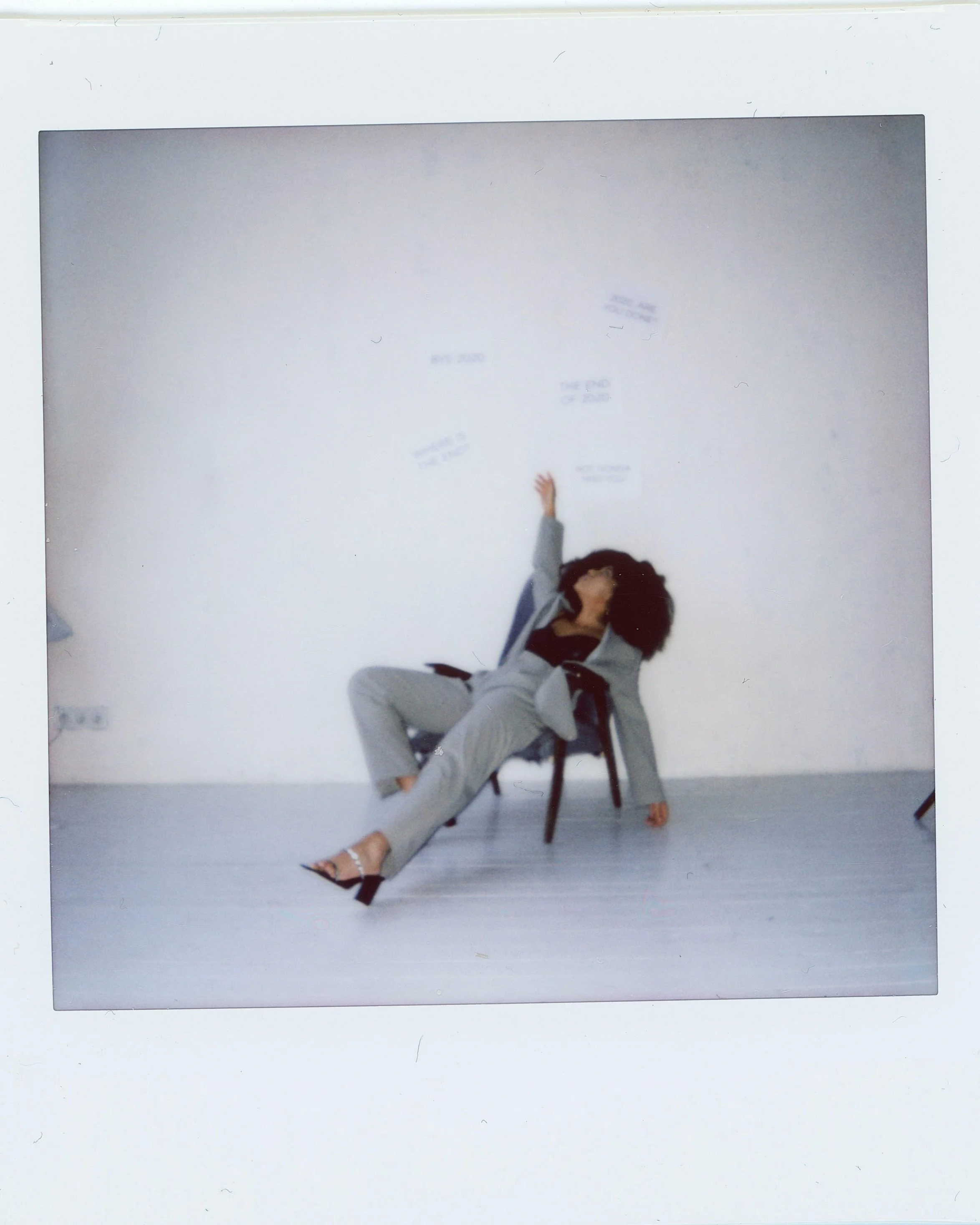 Polaroid of a woman lounging in a chair beneath hand-written notes, part of an anonymised ED recovery quote series for Ianthe House.