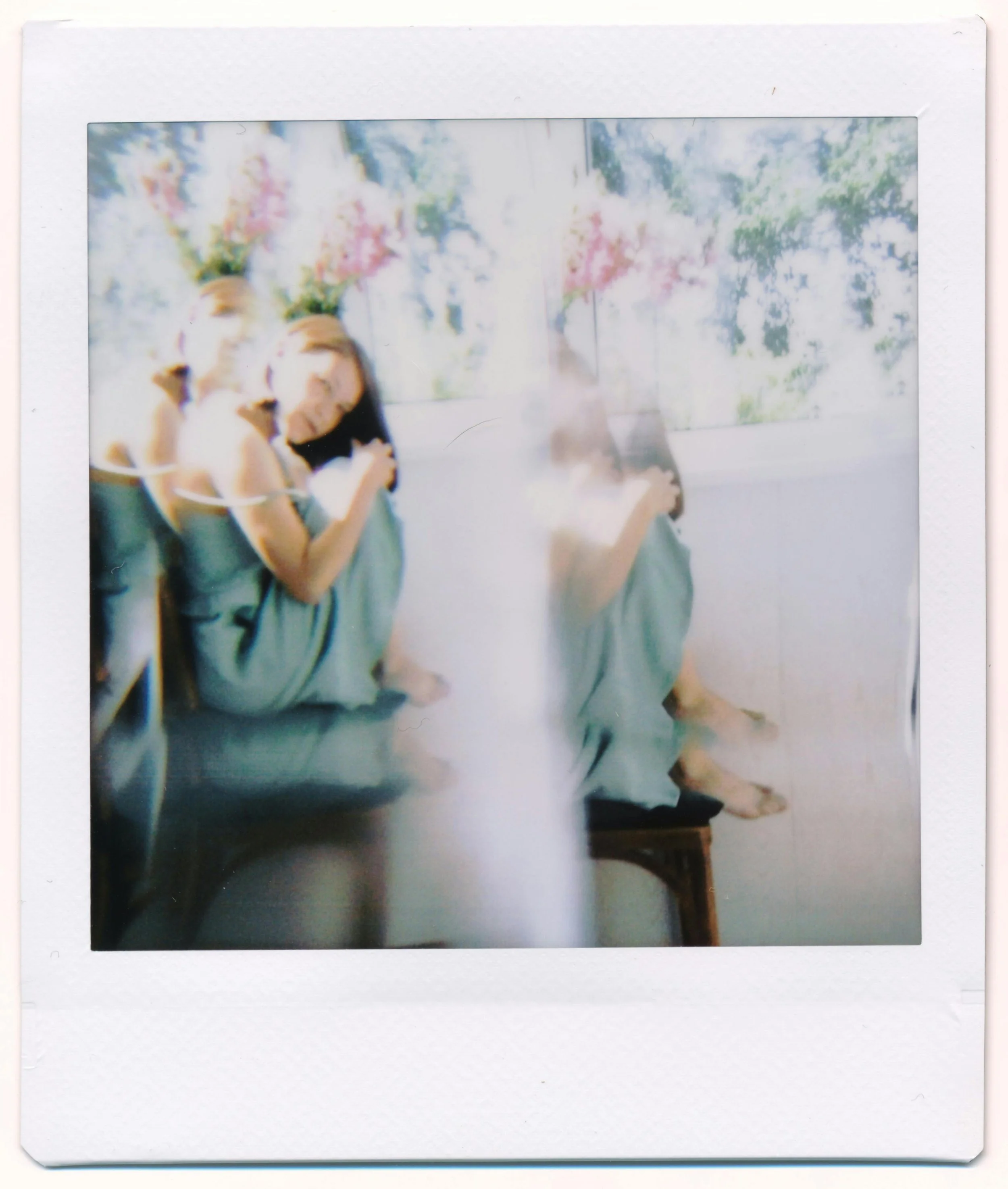 Polaroid-style image of a young woman in a soft blue dress. The image is sunlit and gently blurred. Part of a series of anonymised eating disorder recovery quotes from Ianthe House.
