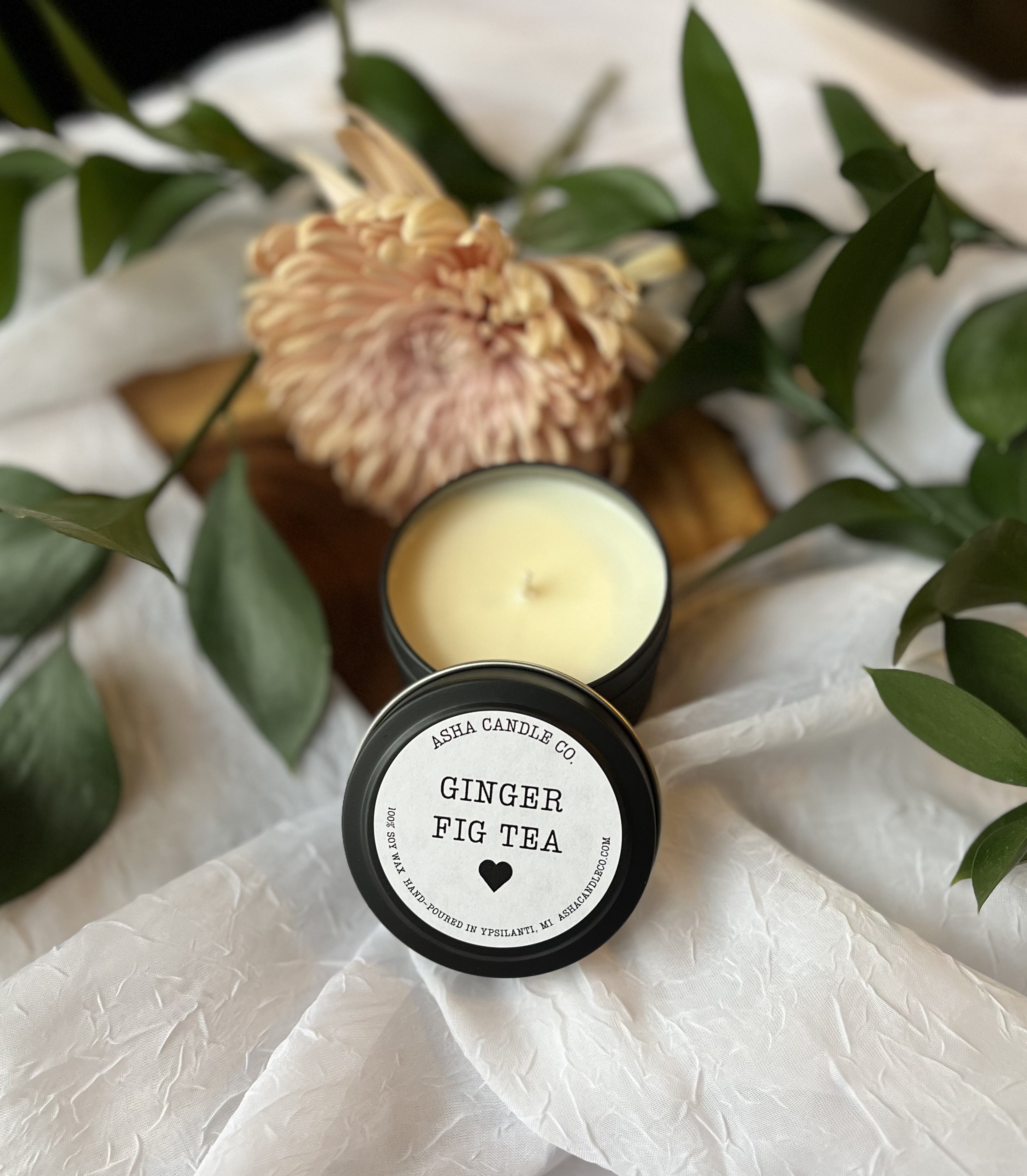 4oz black matte round tin. White round label on lid with black writing and a black heart.