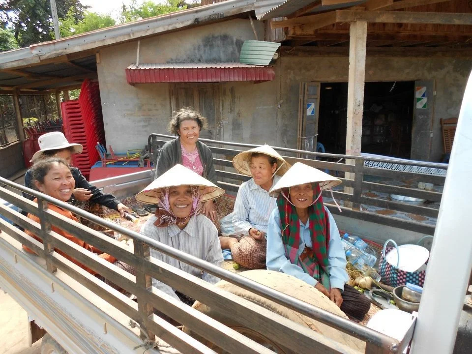 In Mahaxay Laos, where my mom and aunts and ladies from the village traveling in the back of a truck.