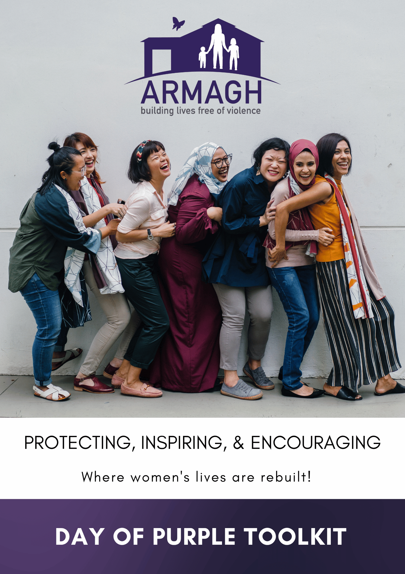 A diverse group of women standing in a line, holding each other and smiling, in front of a logo with a house and the text "ARMAGH building lives free of violence." The image promotes the Day of Purple Toolkit, focusing on protecting, inspiring, and e