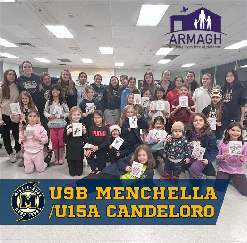 Group of children and teens at a community event holding holiday-themed coloring pages, with a logo of ARMAGH and text for USB Menchella U15A Candeloro at the bottom.