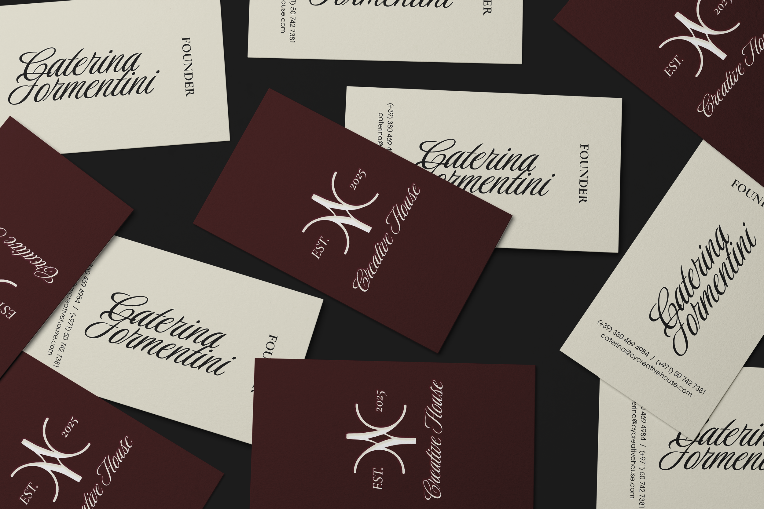 A collection of business cards for CATERINA FORMENTINI, a professional event planner or caterer. The business cards are in cream and maroon colors, with the name and contact information printed in elegant fonts.