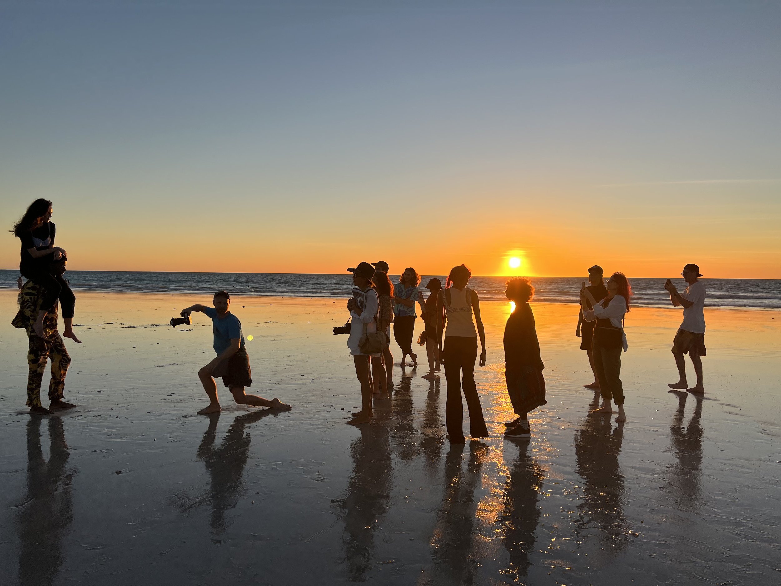 Crew and talent at sunset on Cable Beach, Broome
