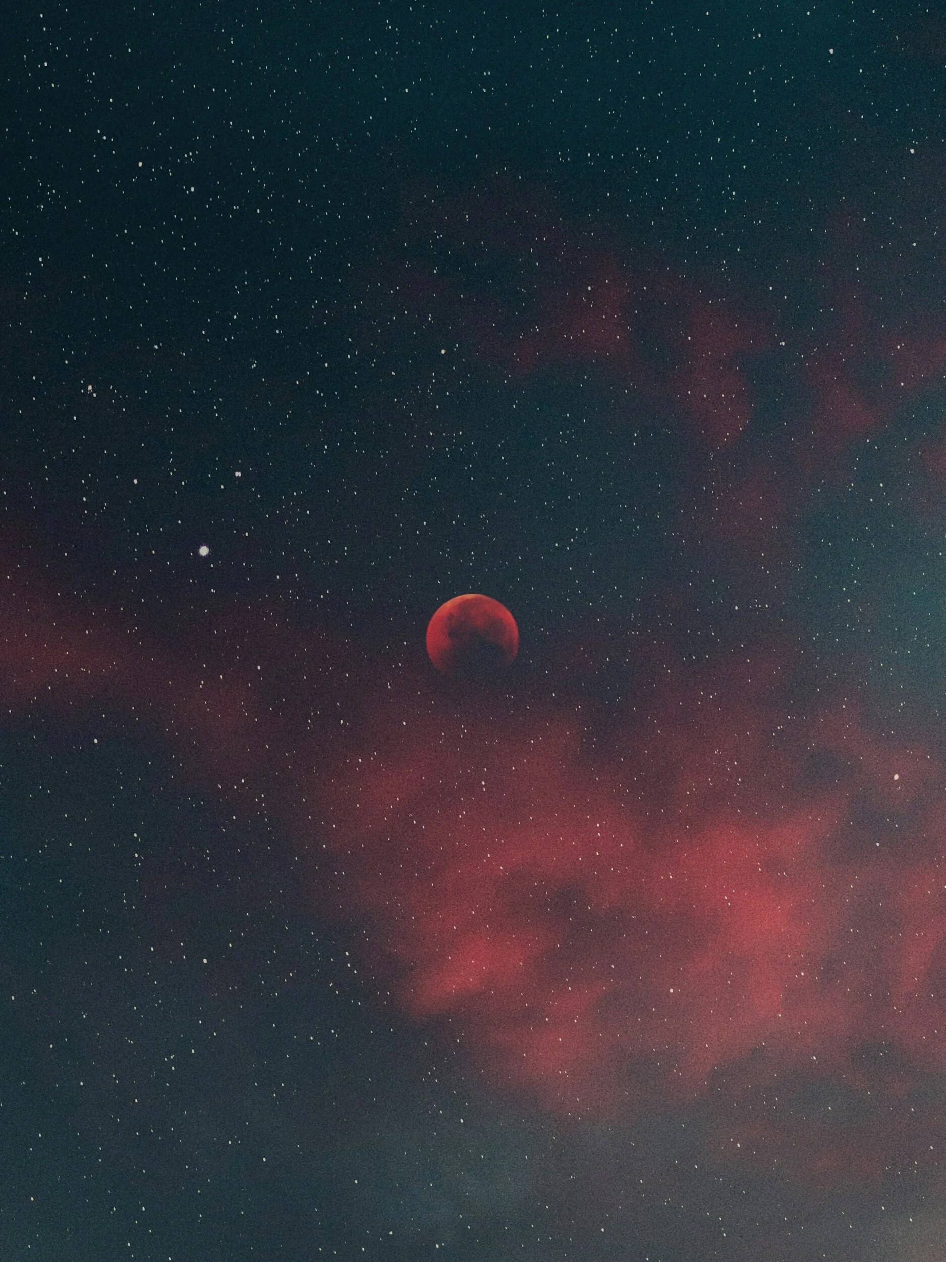 Night sky with red moon and stars