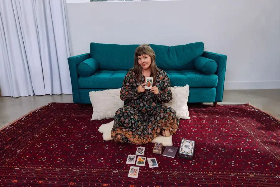 Sarah Jane Chapman, tarot reader and teacher, with her Be With Your Body tarot deck in Nashville