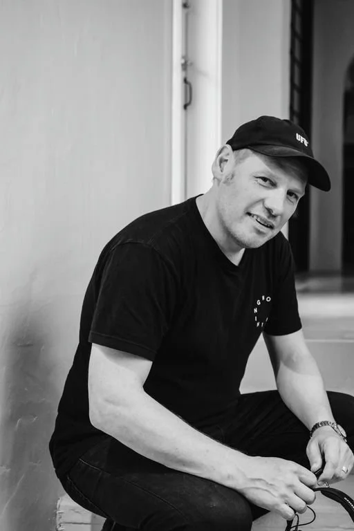 BLACK & WHITE IMAGE OF A MAN, DJ TOMMY THOMAS.