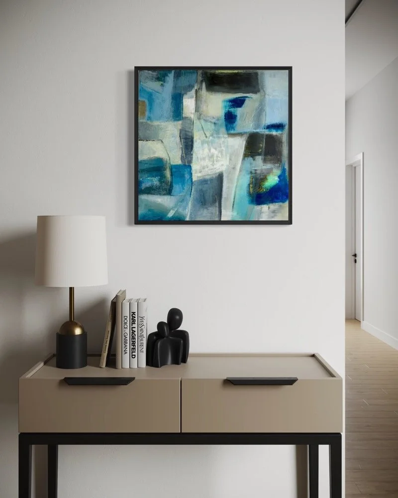 Abstract paiting by gera Dunachie in Blues and whites hanging over a modern console in a hallway