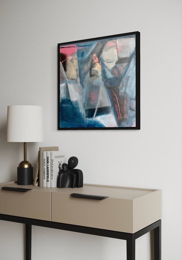 Contemporary abstract painting by Gera Dunachie, featuring emotive, gestural brushwork in deep indigo, slate grey, and translucent whites, punctuated by sharp accents of vibrant neon pink and earthen terracotta. Hung above modern furniture