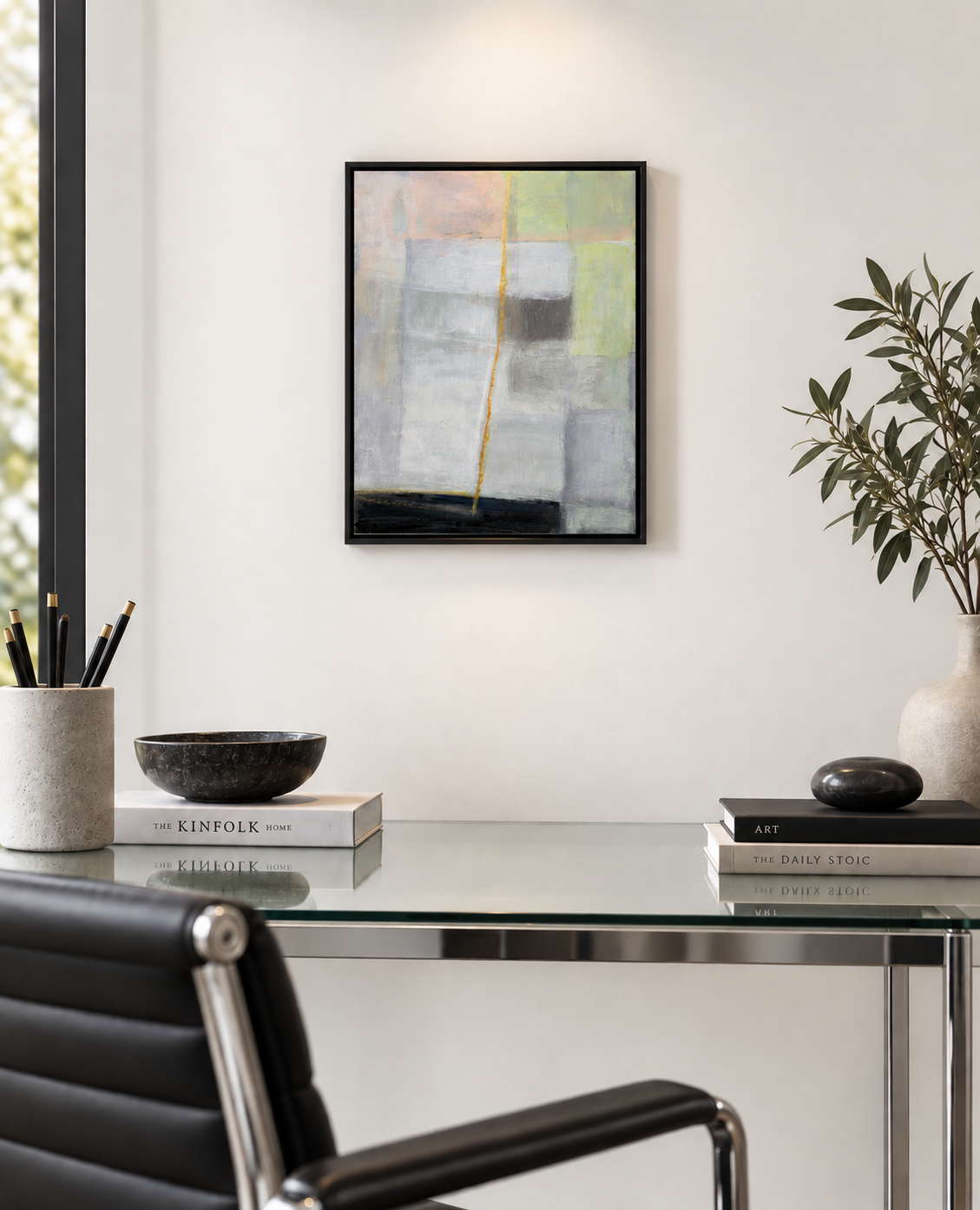 Hidden Fracture, abstract painting by Gera Dunachie in a black frame, displayed above a glass-and-steel desk with a black leather chair in a contemporary study.