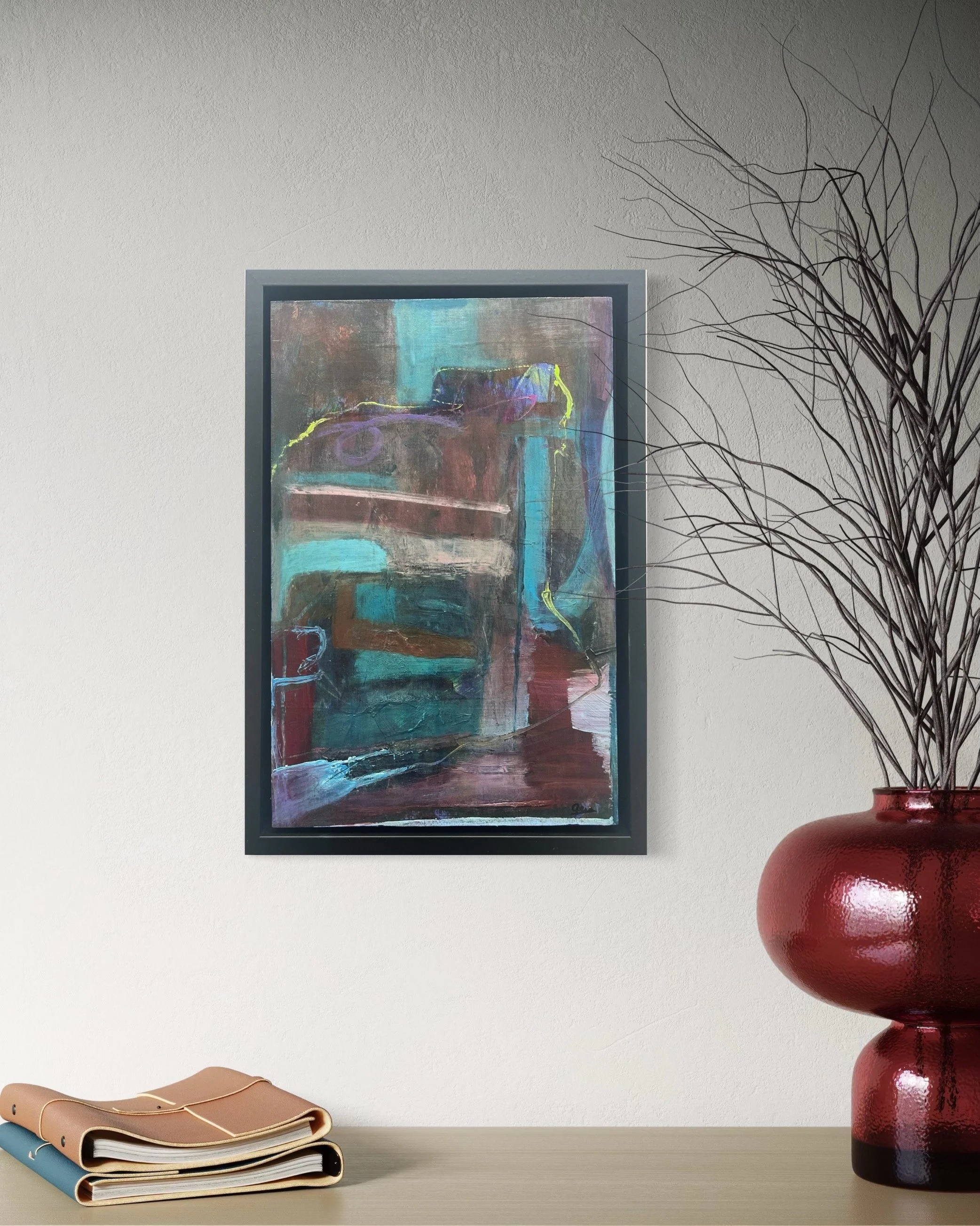 Baroque by Gera Dunachie displayed in a black frame beside a minimalist vase, showing how the piece adds a rich, dark focus to a contemporary space.