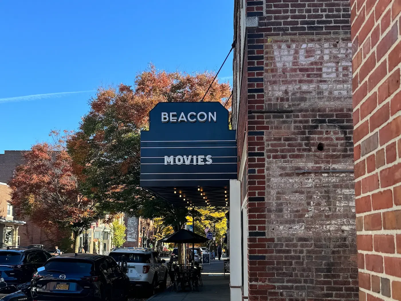 beacon movies marquee sign with fall trees in background
