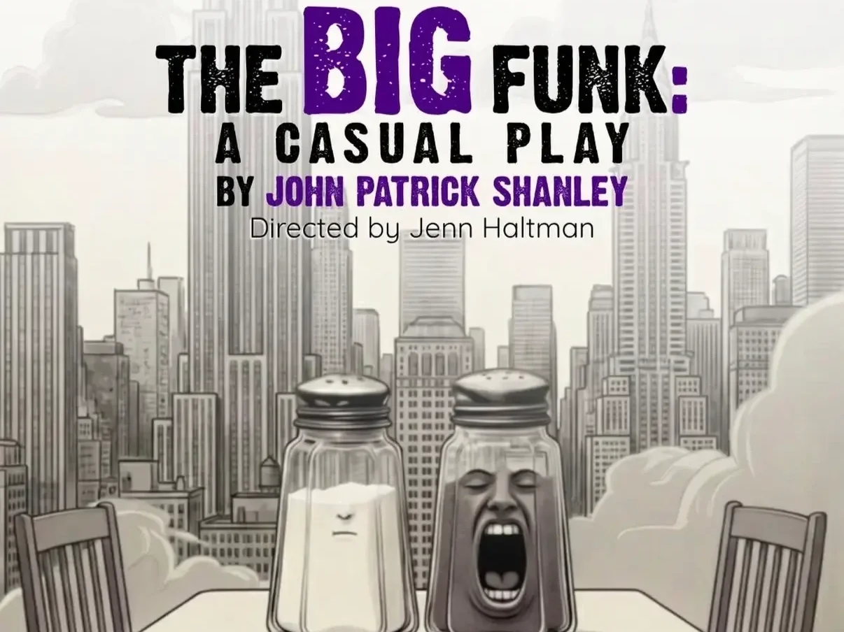 salt and pepper pots sit on a table with a New York skyline in the background.